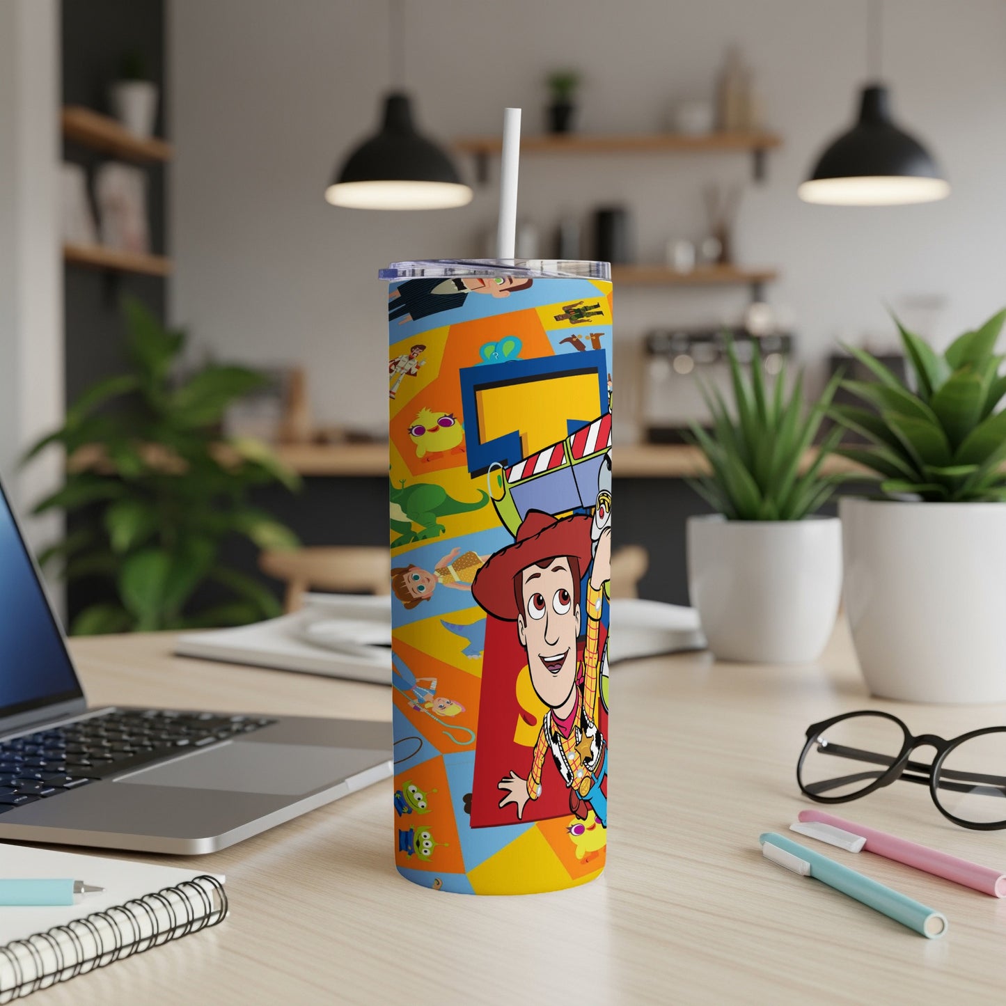 Toy Story's Woody character on a colorful tumbler with a straw.