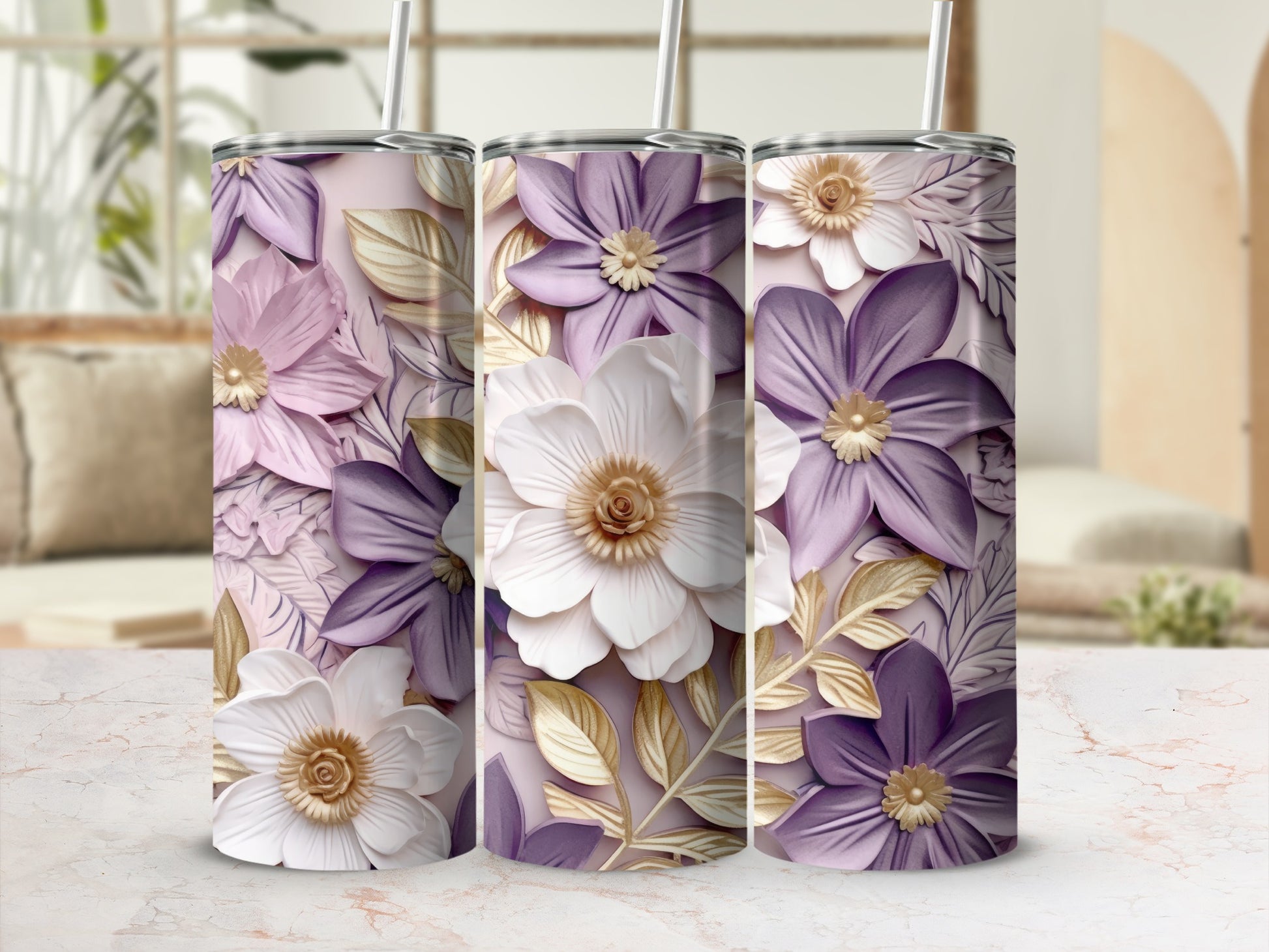 Three tumblers with purple and white flowers and gold leaves.