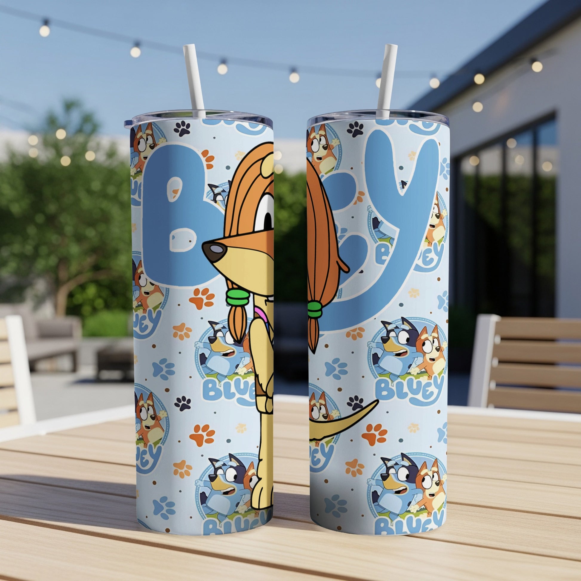 Bluey characters on a light blue tumbler with a straw, patterned background.