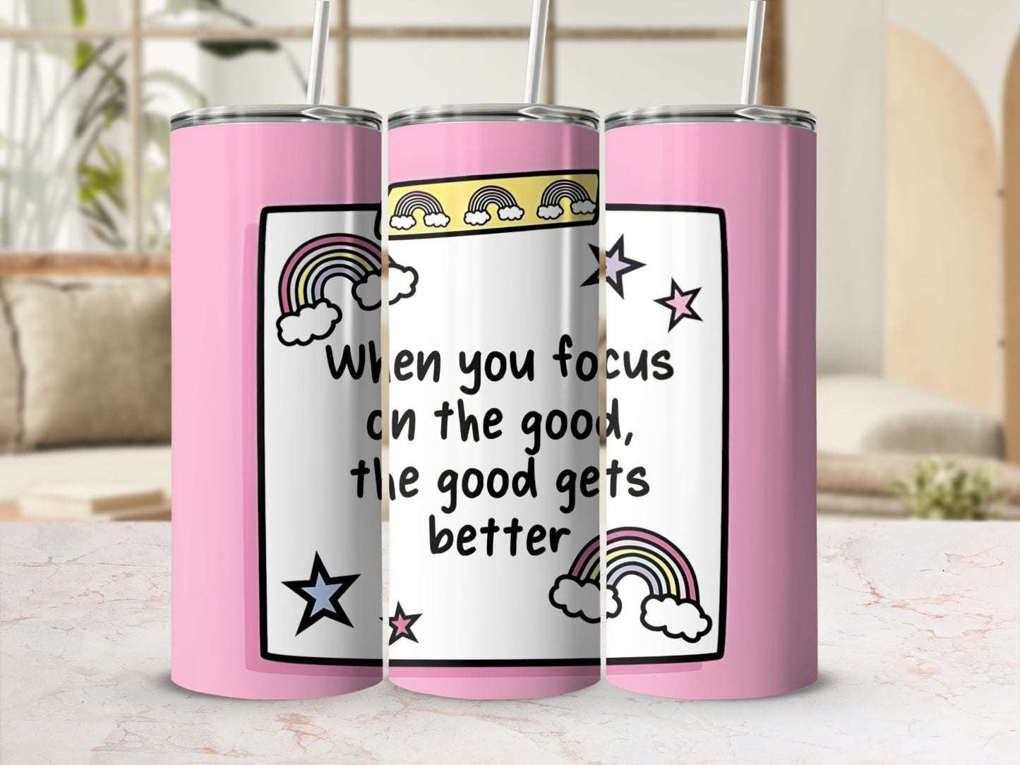 Pink tumbler with rainbow and star design, "When you focus on the good, the good gets better."