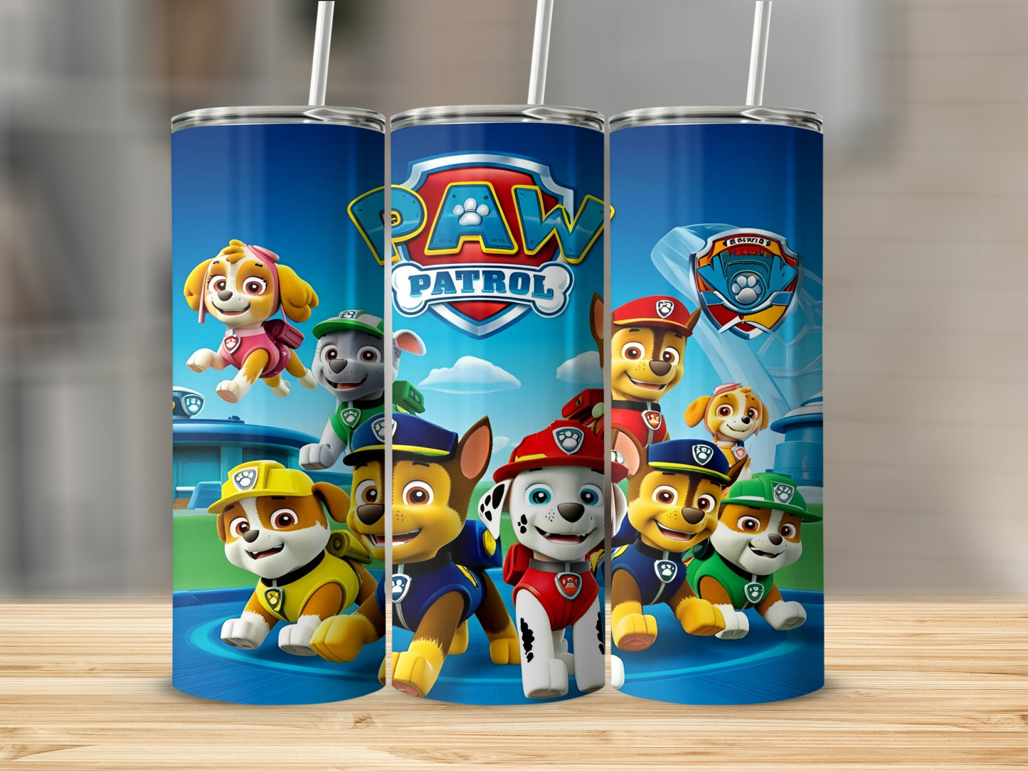 Paw Patrol characters Chase, Marshall, Rubble, Skye, and Zuma on a blue tumbler.