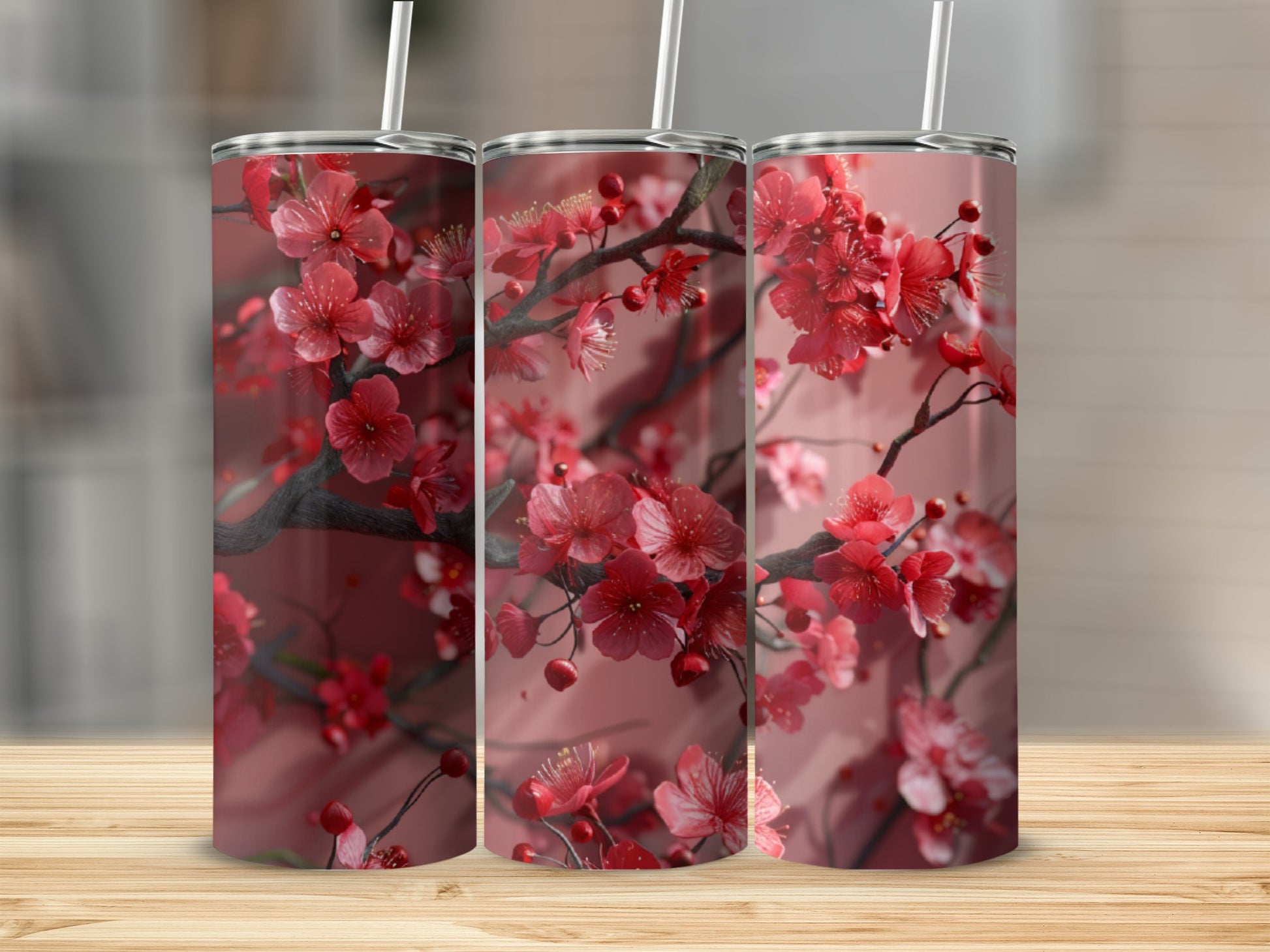 Three tumblers with a red cherry blossom floral design.