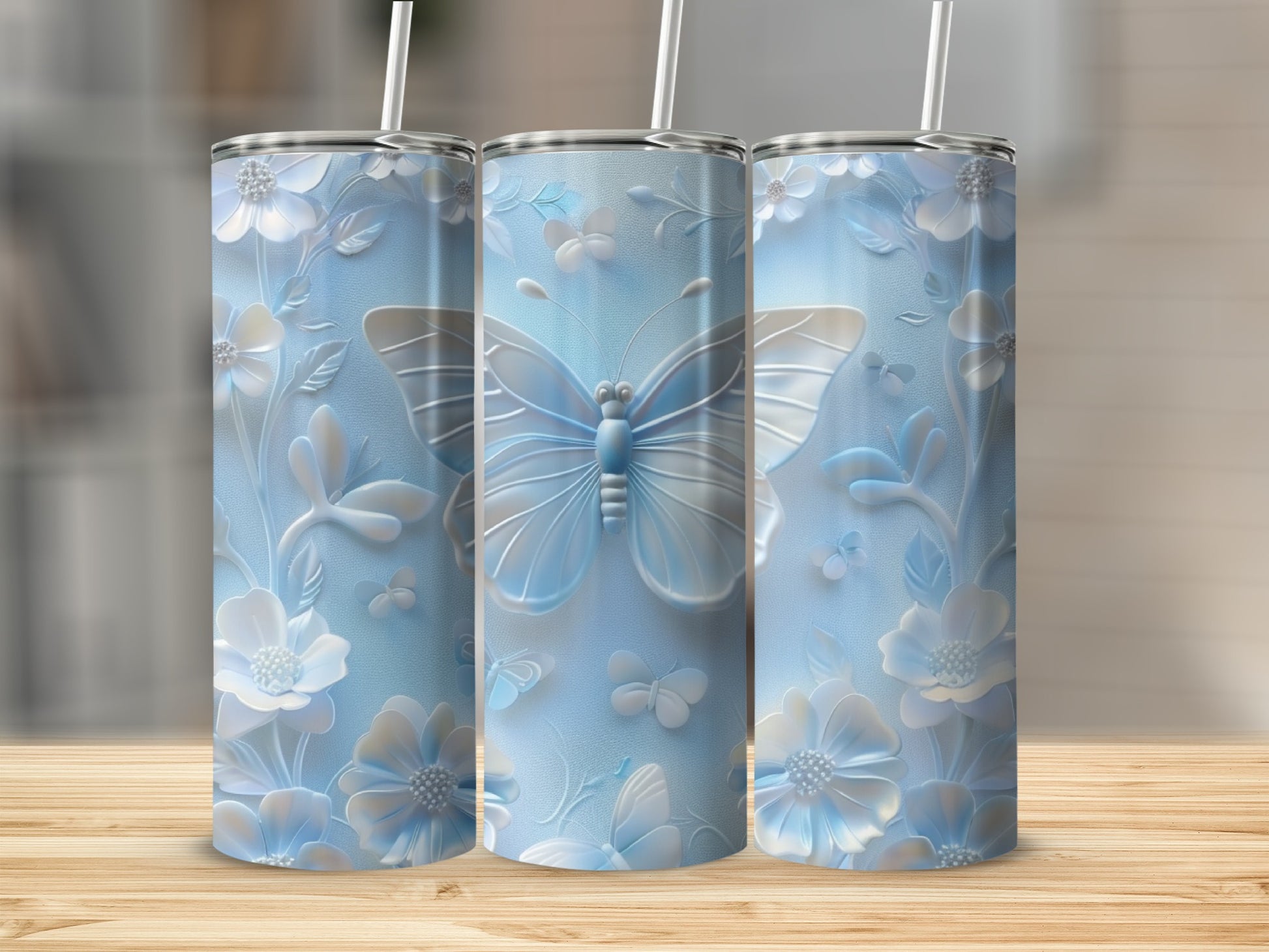 Light blue tumbler with embossed butterflies and floral details.