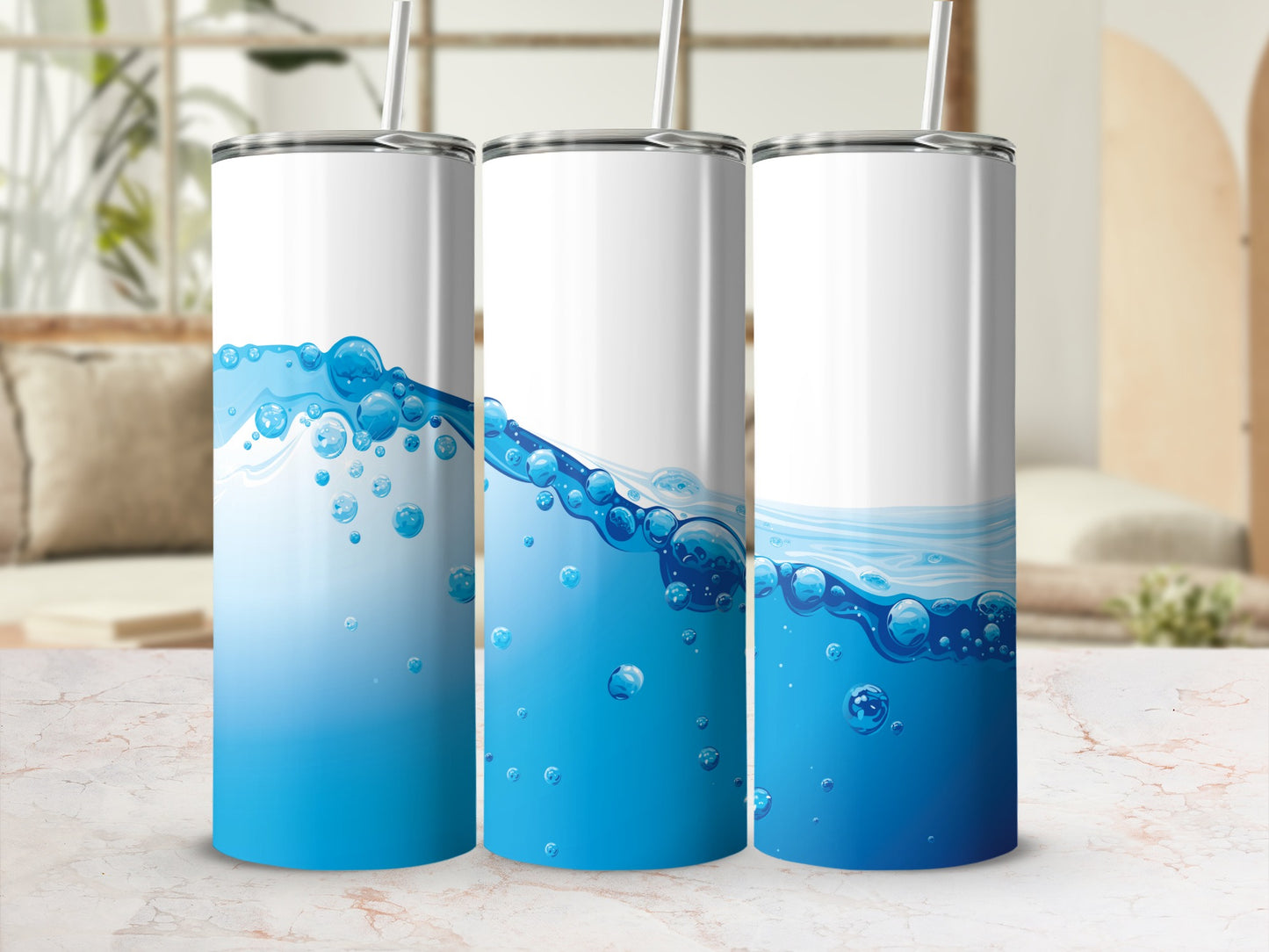 Three stainless steel tumblers with a blue water and bubble design.