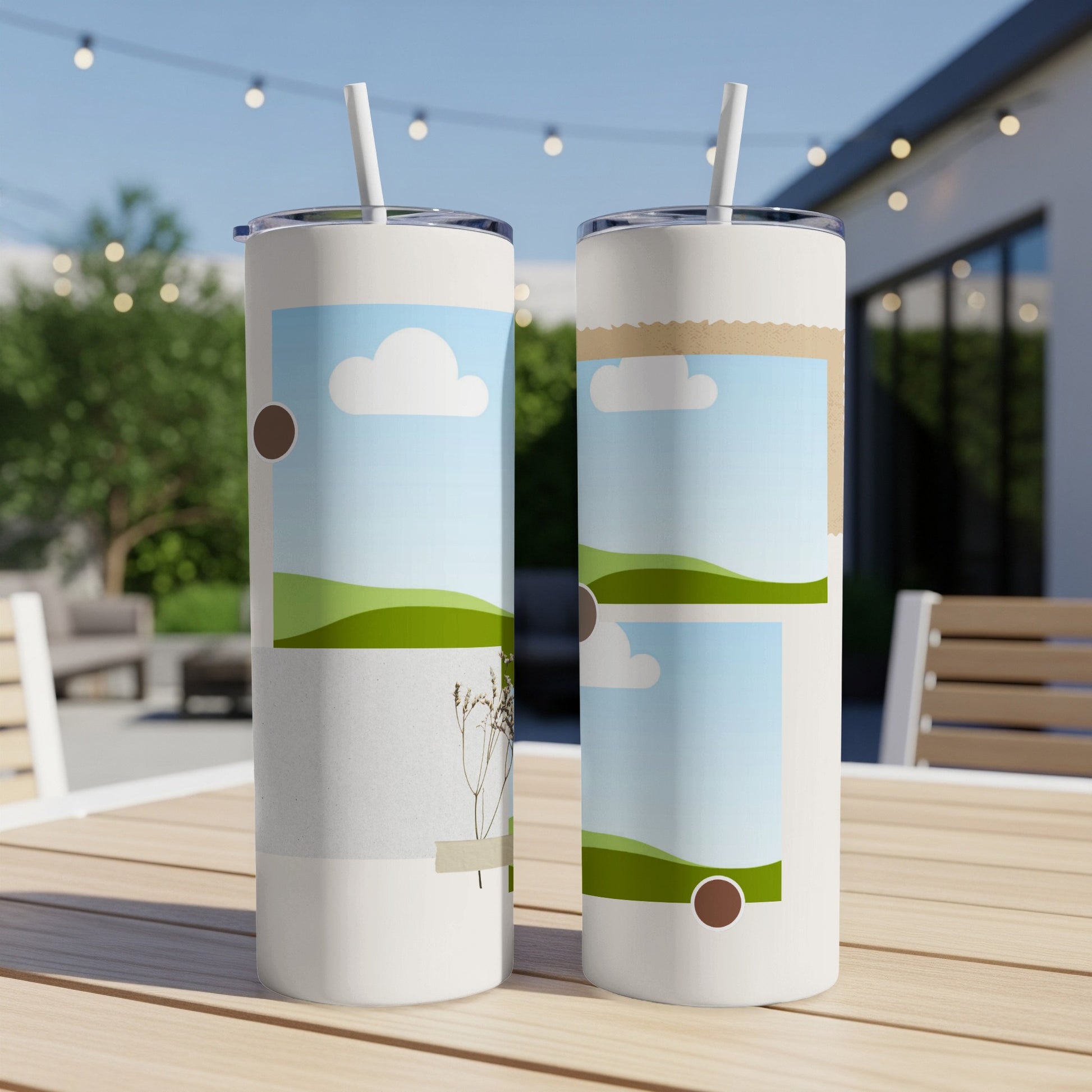 Two white tumblers with straw lids displayed on a wooden table with an outdoor background.