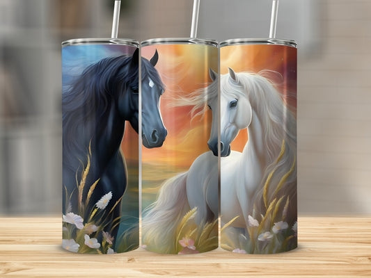 Black and white horses with flowing manes stand in tall grass.