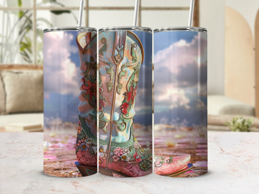 Pink and blue cowboy boot tumbler with floral embroidery and straw.
