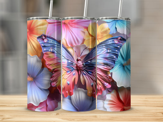 Three tumblers with colorful butterflies and floral designs.