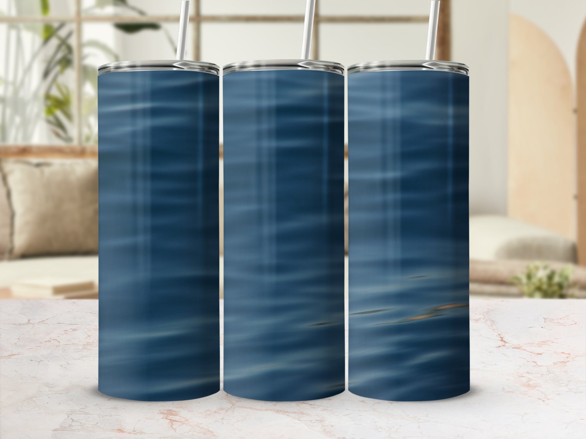 Three tumblers with a rippling blue water pattern.