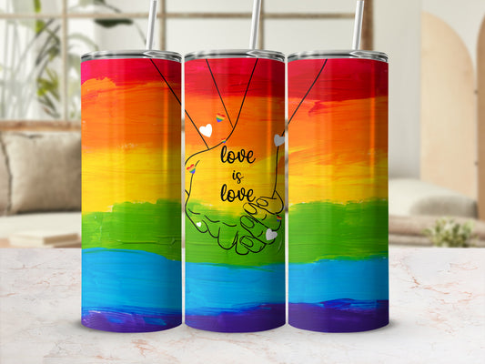 Rainbow tumbler with "love is love" text and intertwined hands graphic.