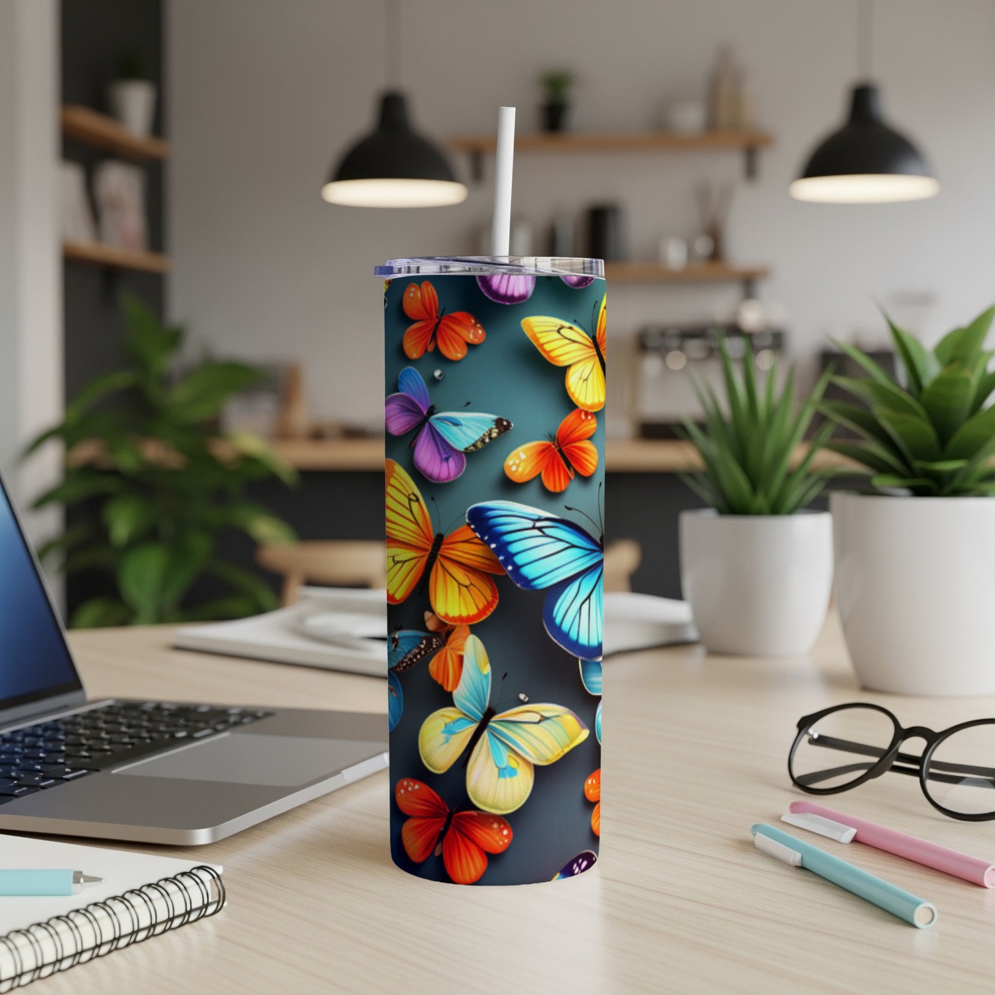 Tumbler with colorful butterflies on a dark background.