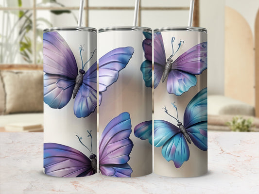 Purple and blue butterfly pattern on three white tumblers.