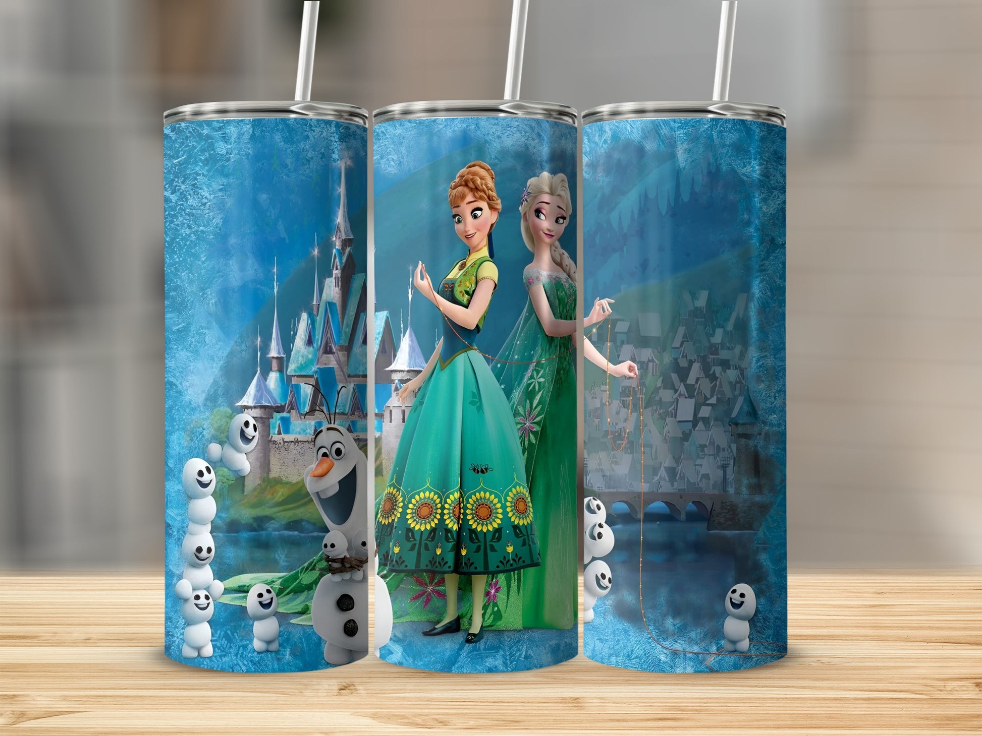 Elsa and Anna from Frozen on a tumbler with snowmen and a castle.