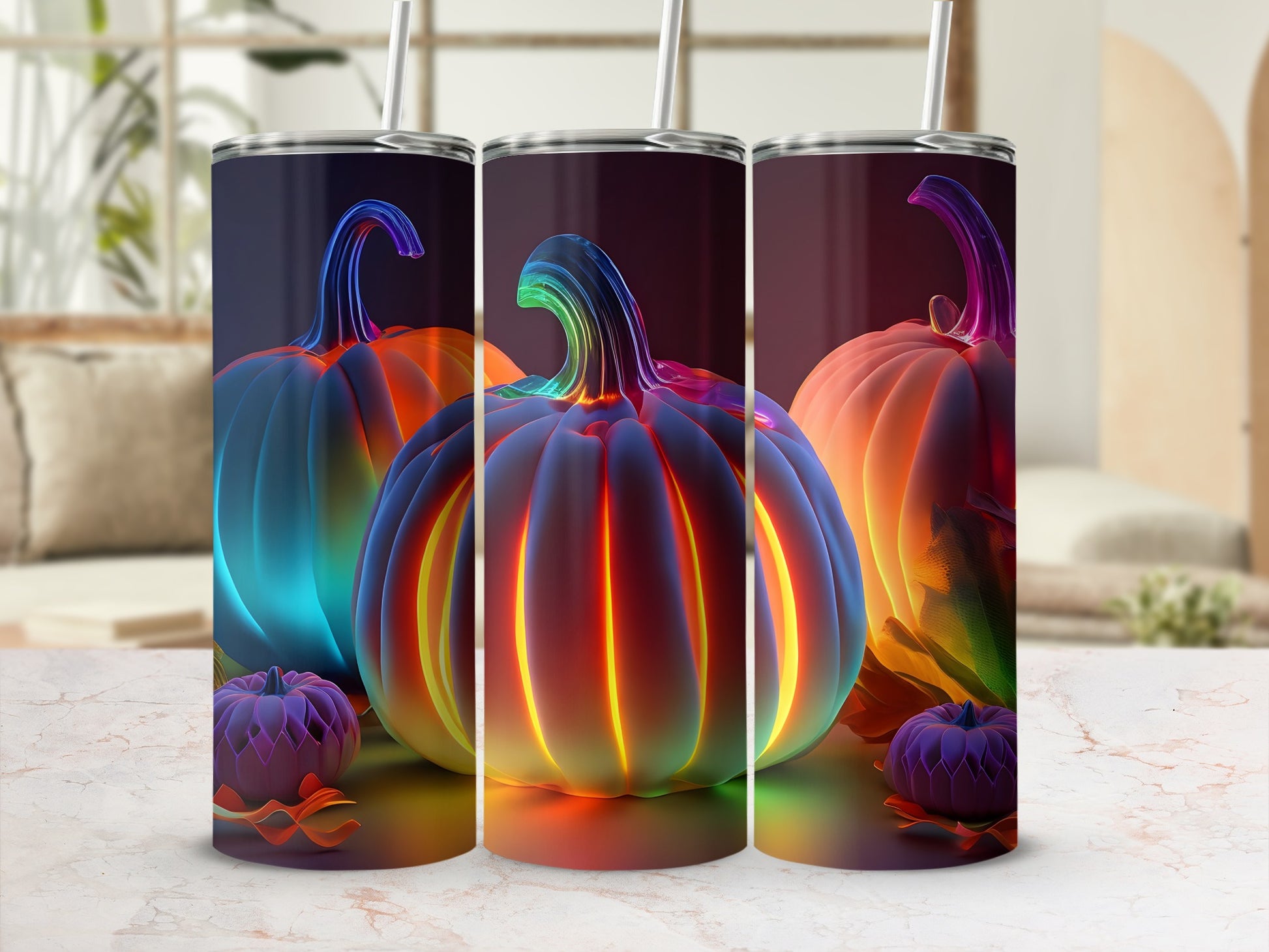 Three glowing, colorful pumpkins with straws on a marble surface.
