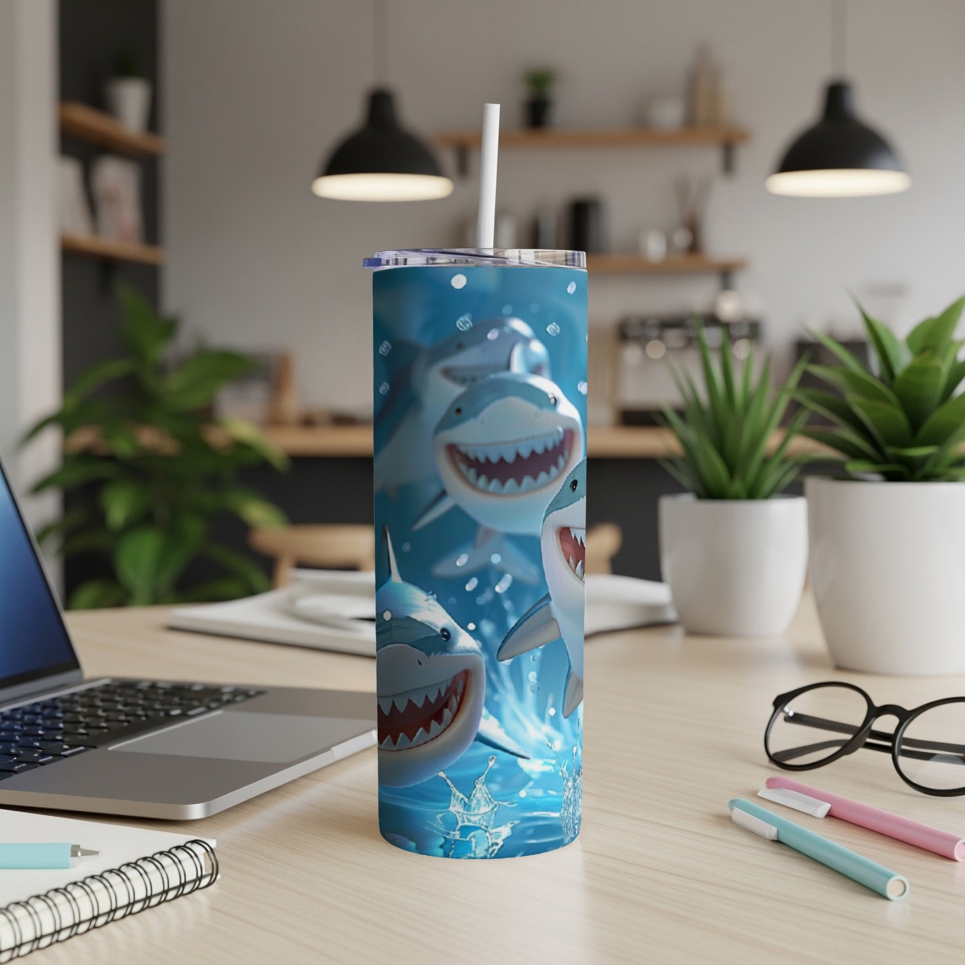Tumbler with smiling sharks and water splashes.