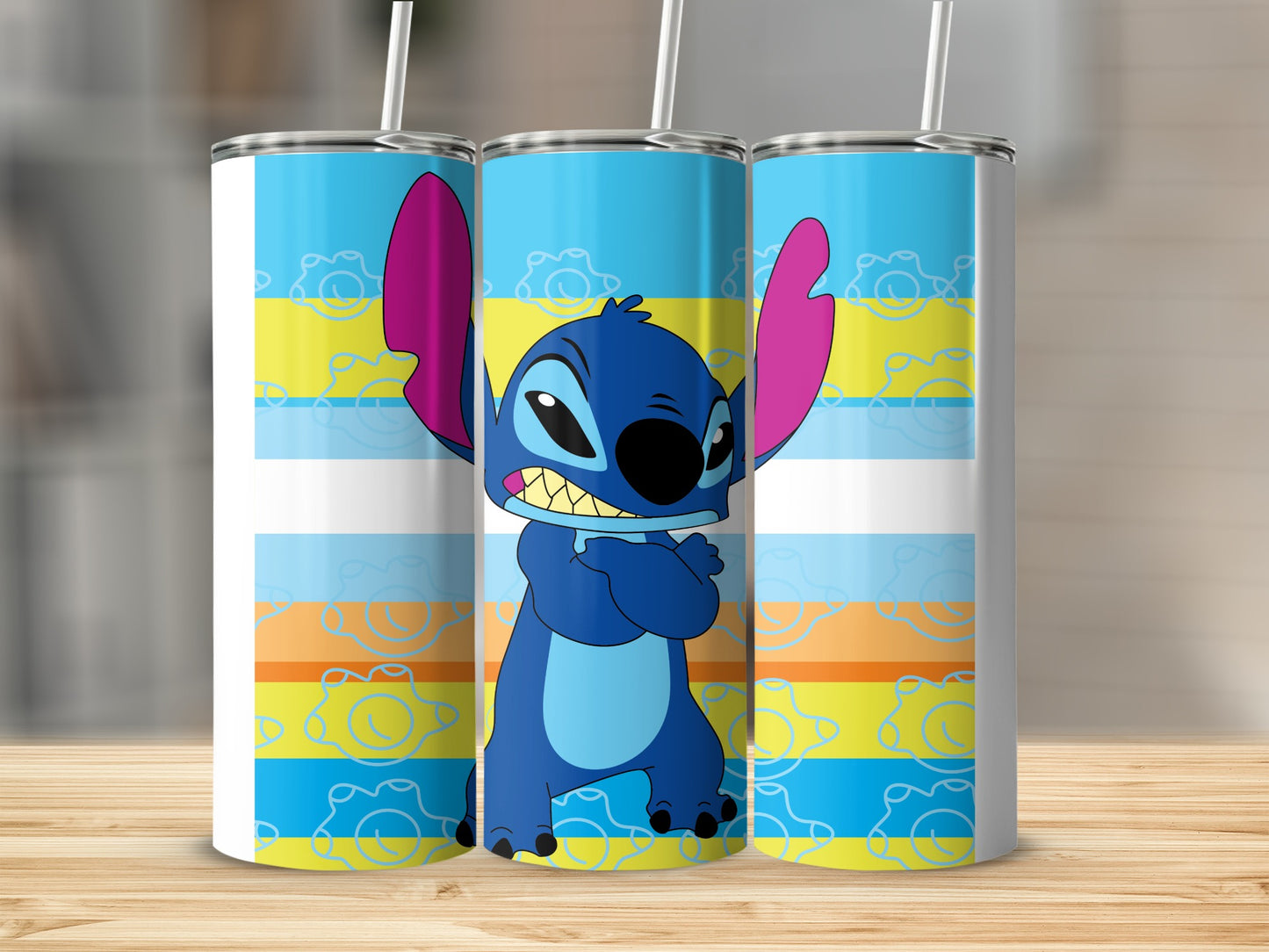 Blue Stitch character on a white, blue, yellow, and orange striped tumbler.