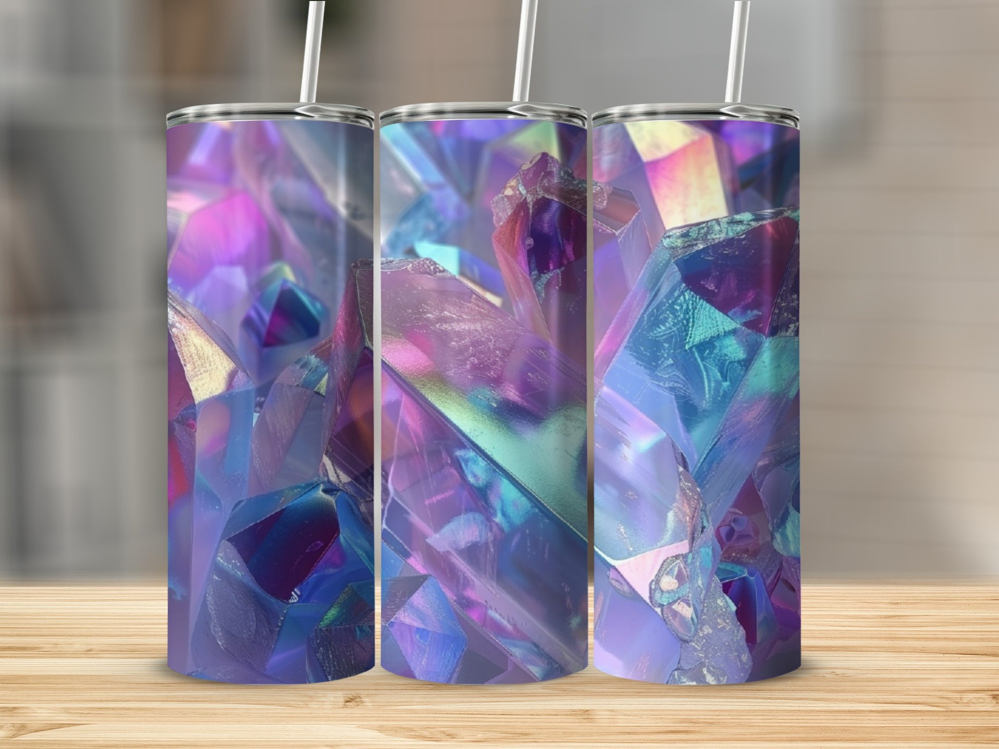 Triptych of iridescent crystal tumblers with straws, set on a wooden surface.