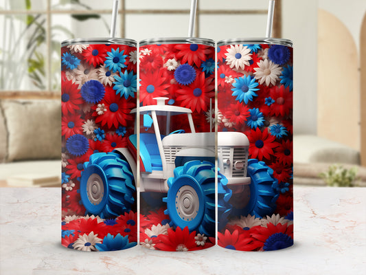 White and blue tractor surrounded by red, white, and blue flowers.