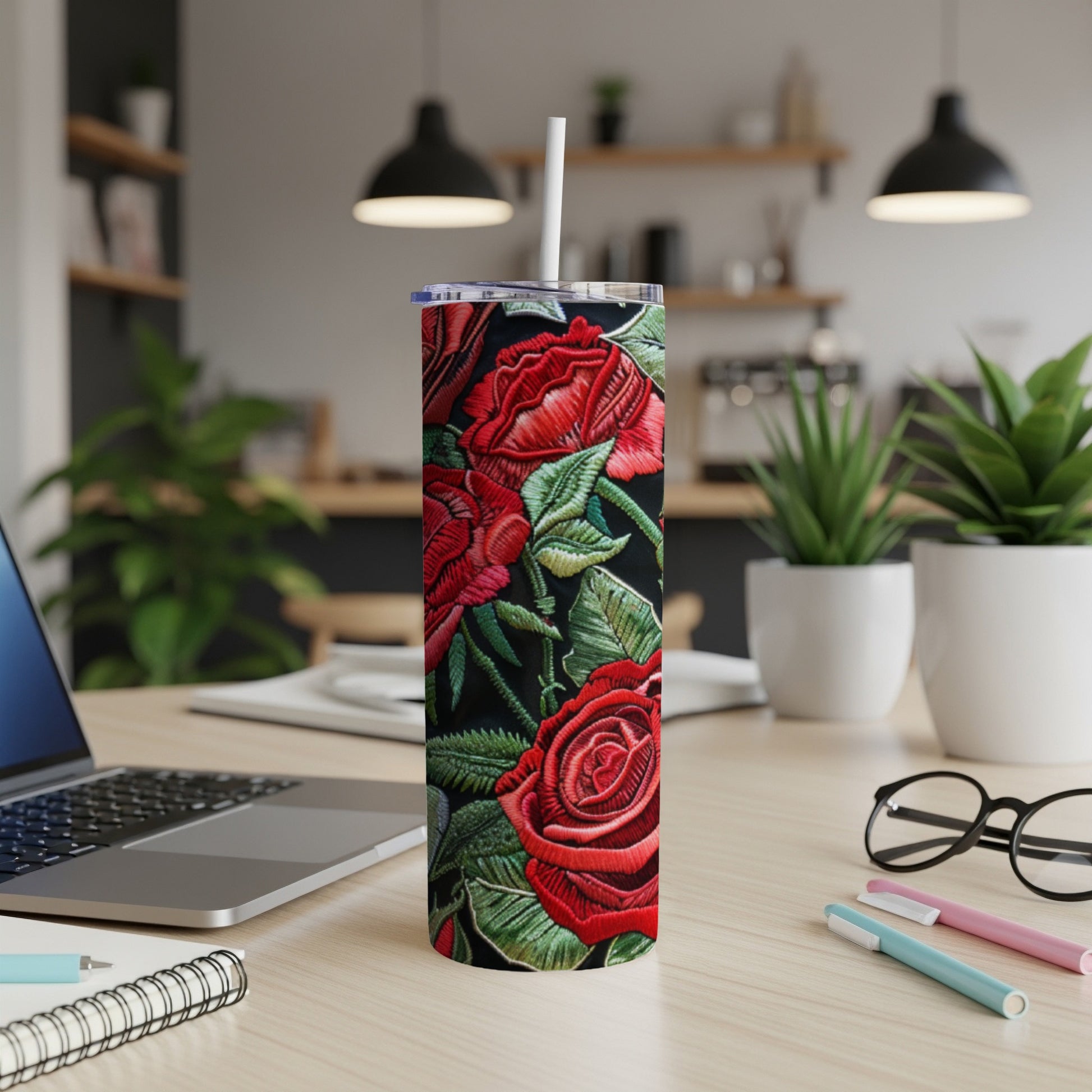 Tall black tumbler with red rose embroidery, white straw.