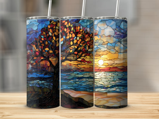 Three stained glass tumblers with scenic tree, sunset, and ocean designs.