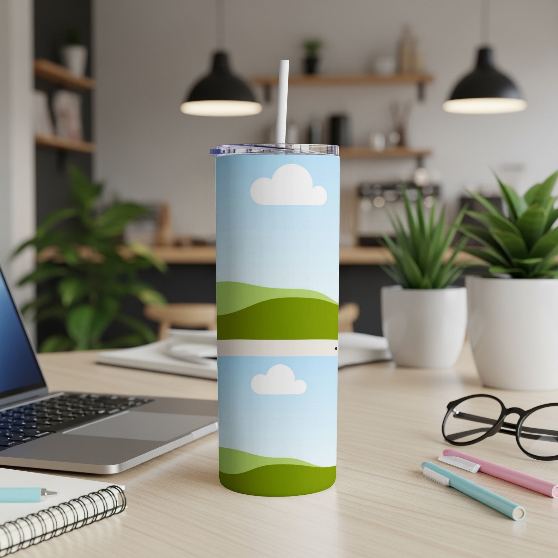 Tall tumbler with sky and rolling green hills design.