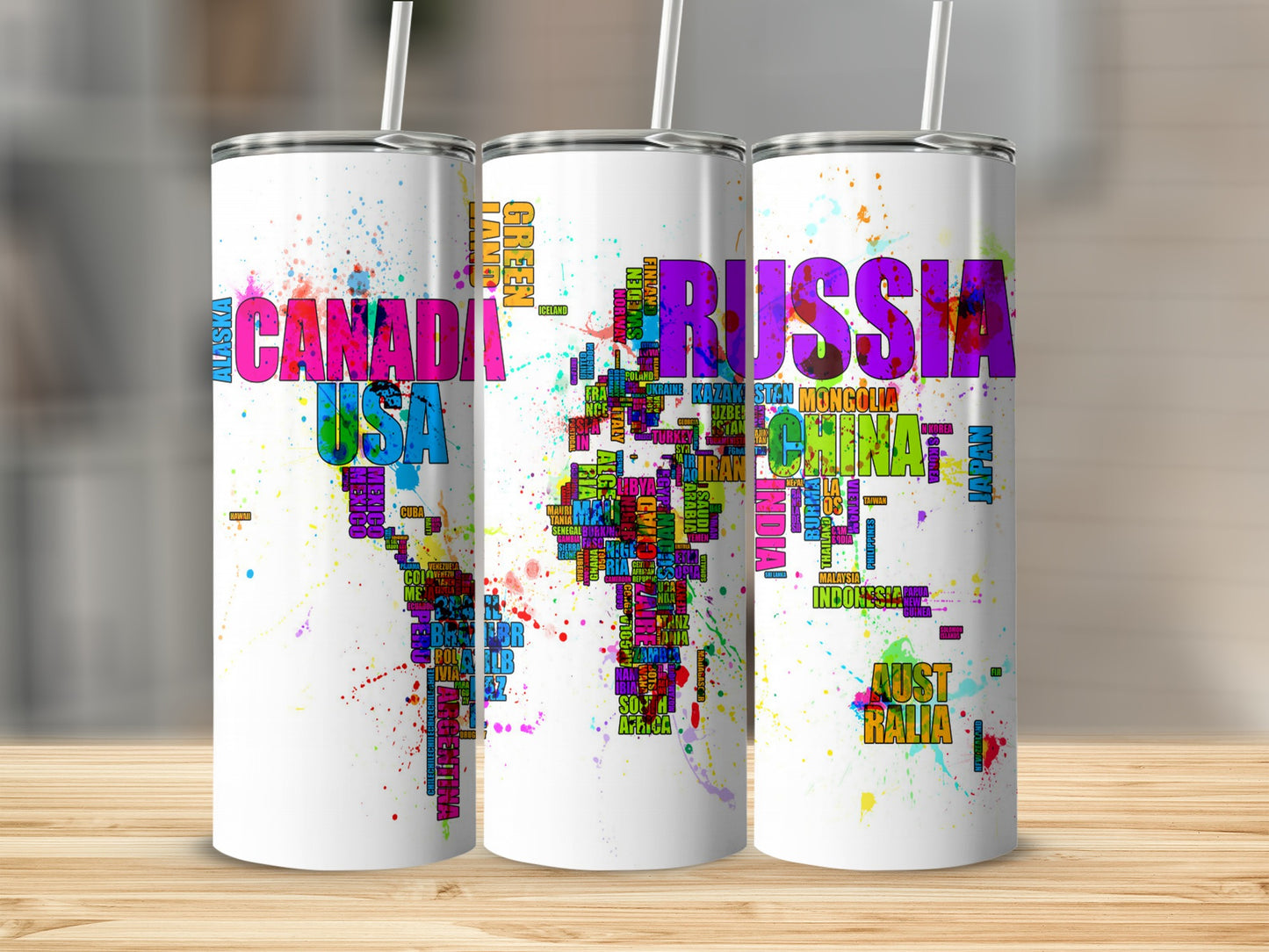 Three tumblers with colorful world map designs featuring country names in large letters.