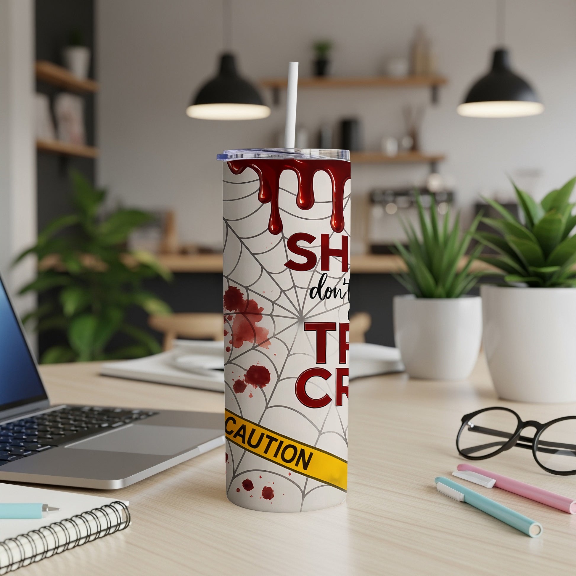 "Sh*t don't matter" text on a tumbler with spiderwebs and blood splatters.