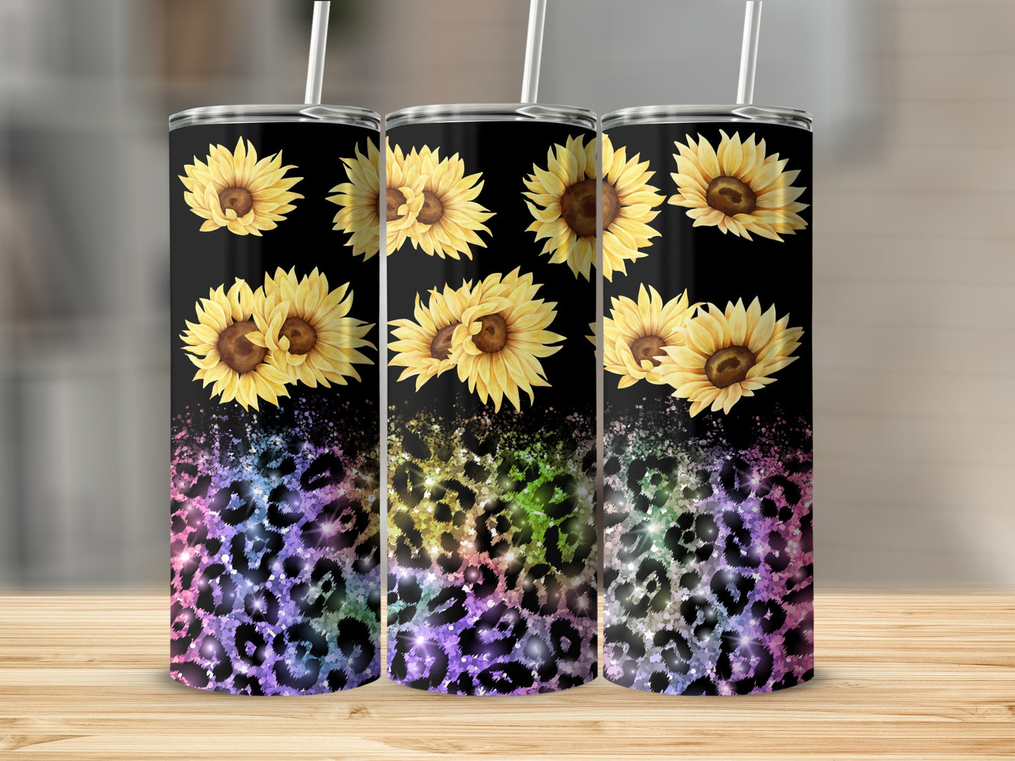 Three tumblers with sunflowers and rainbow leopard print on a black background.