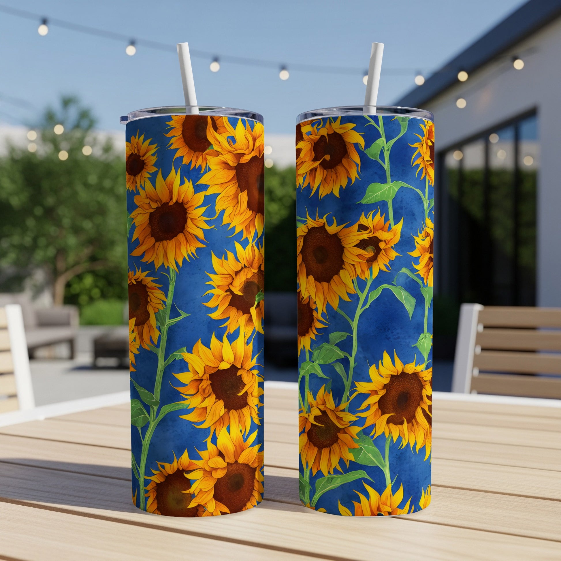 Two tumblers with sunflowers on a blue background.