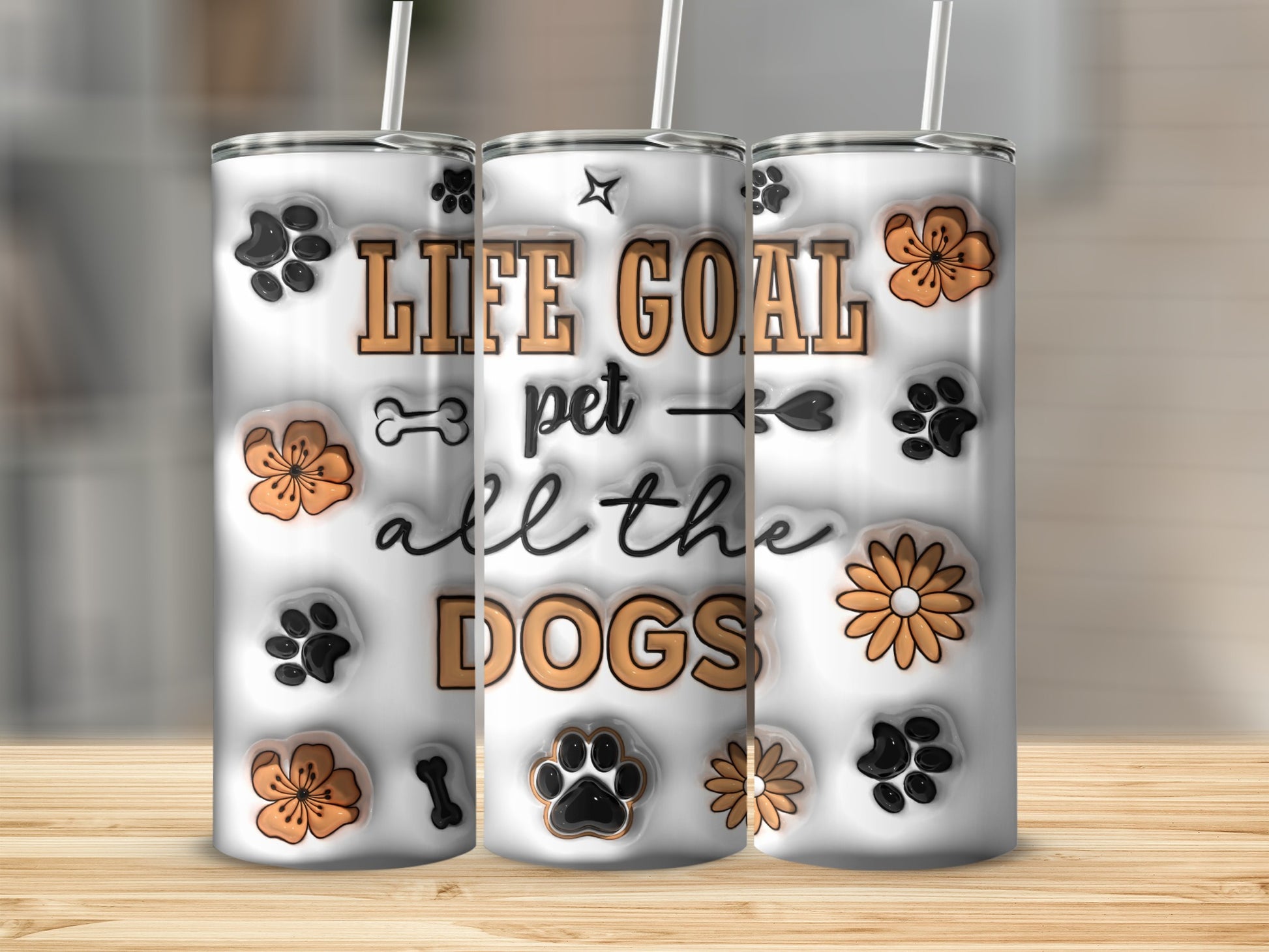 Three tumblers with paw prints and "Life goal pet all the dogs" text.
