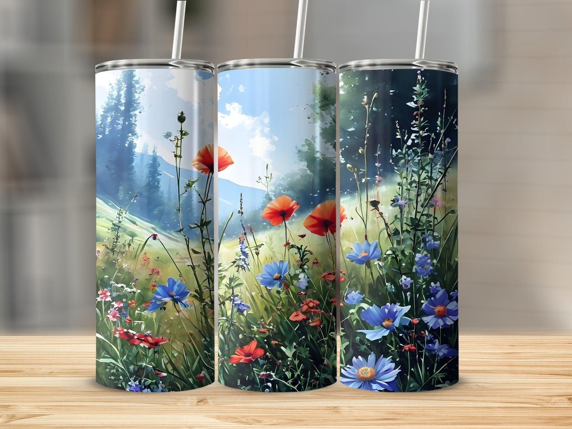 Three tumblers featuring a colorful wildflower meadow with a forest in the background.