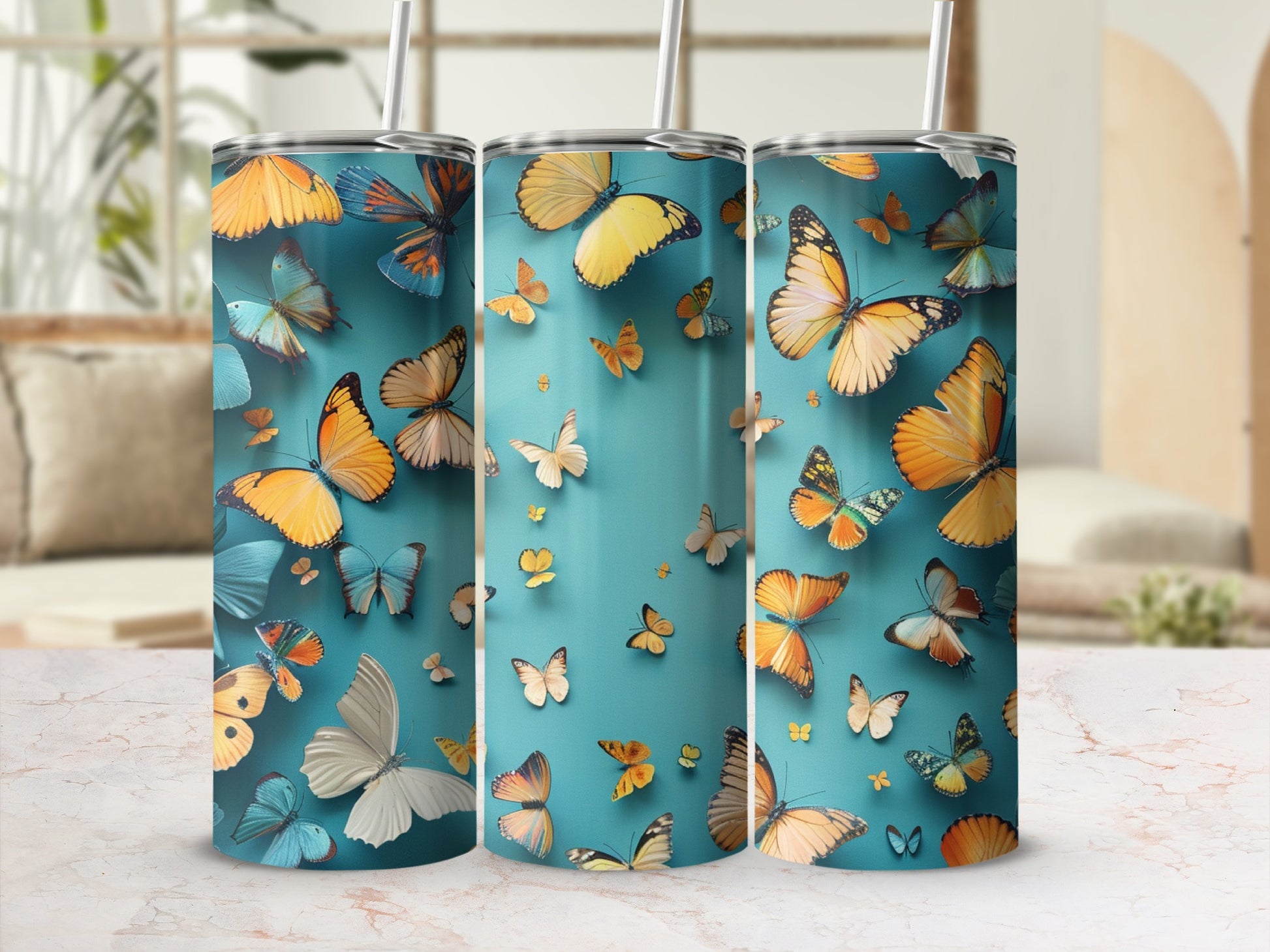 Three tumblers with a watercolor butterfly design.