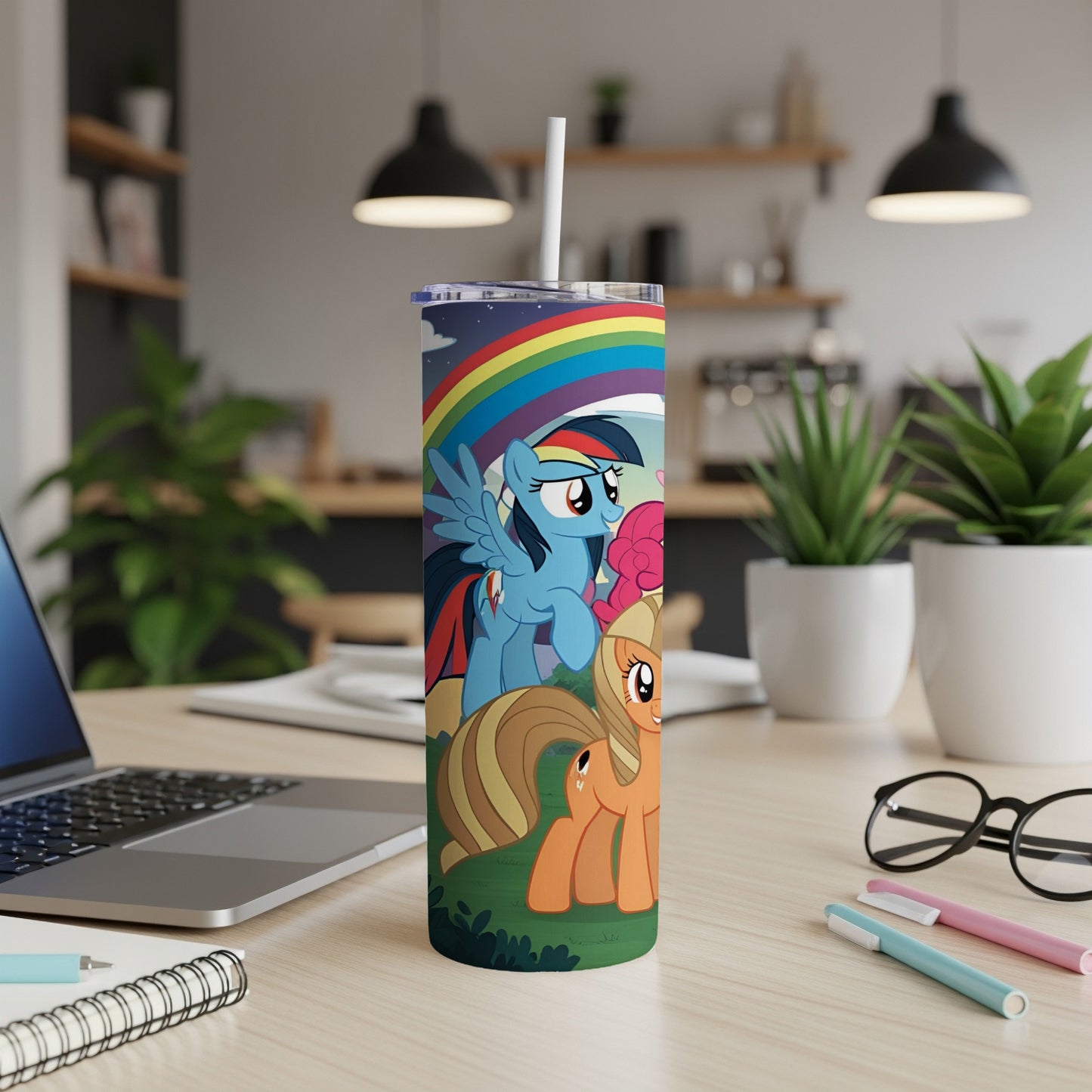 My Little Pony characters on a rainbow-themed tumbler with a straw.