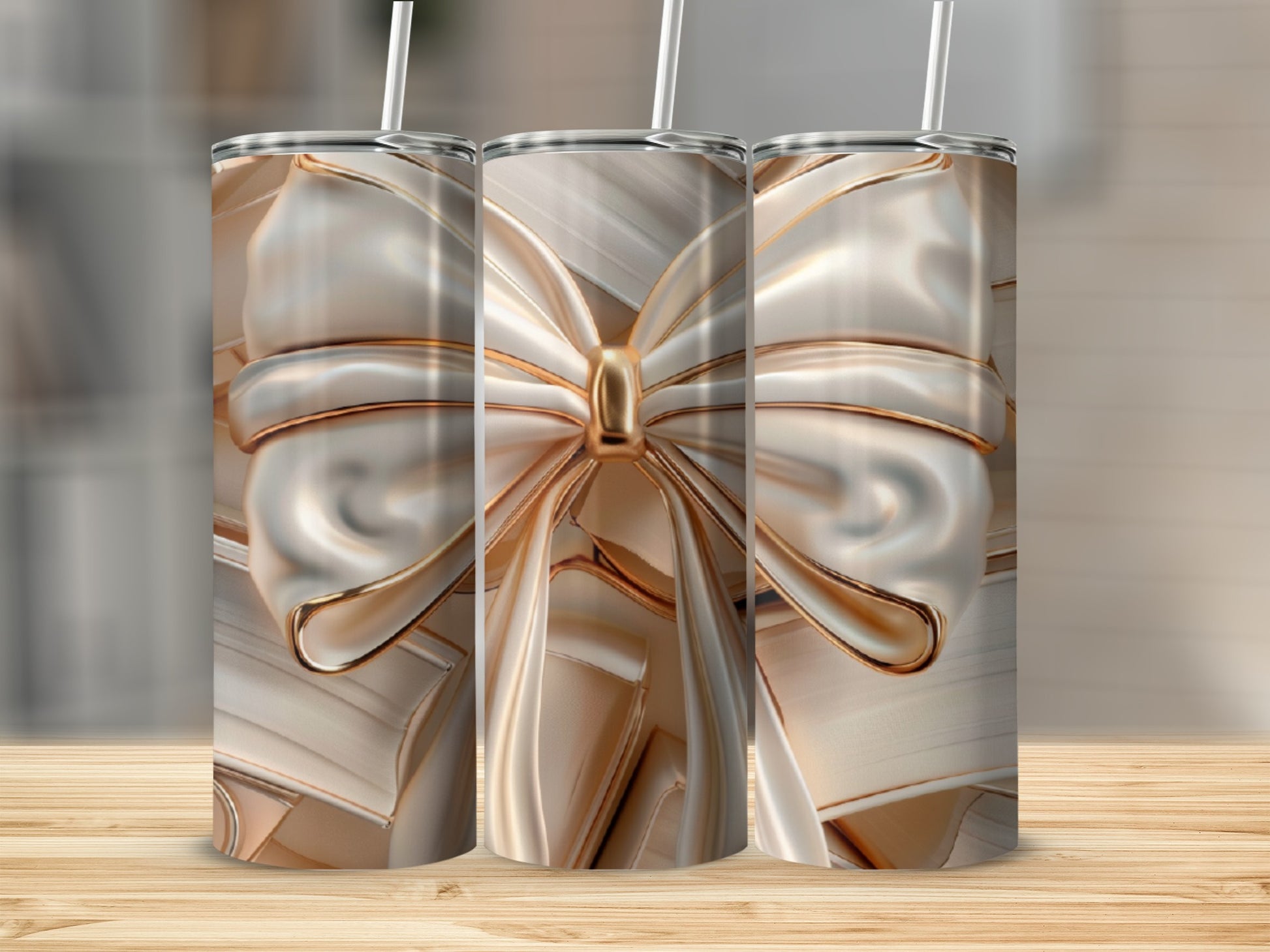 Three tumblers with a champagne ribbon design stand on a wooden surface.