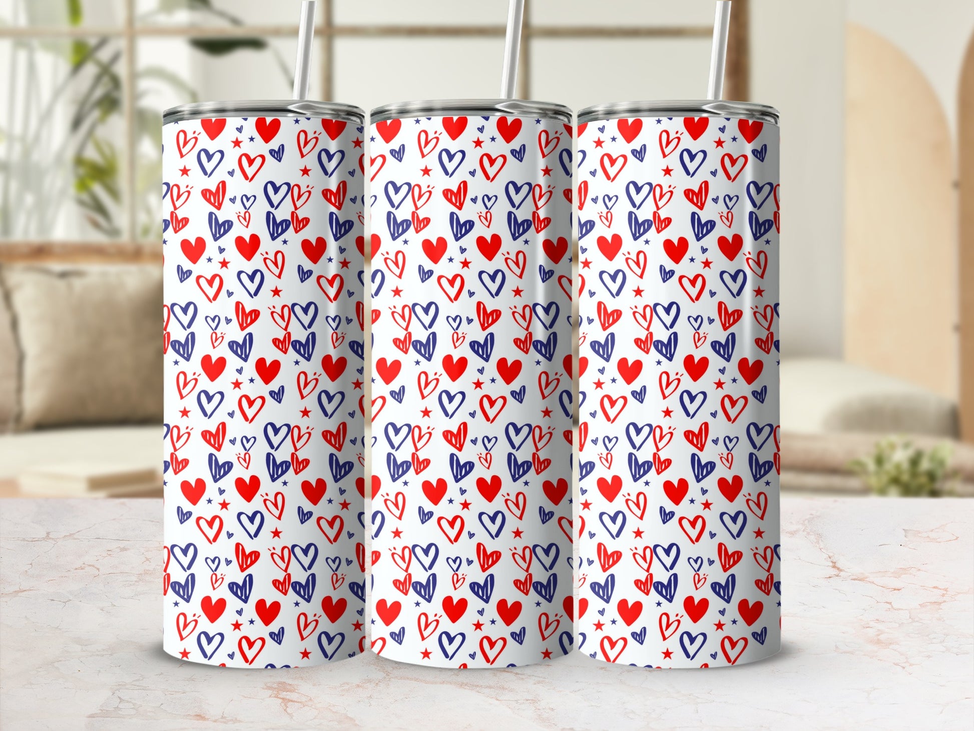 Three tumblers with a repeating pattern of blue and red hearts.