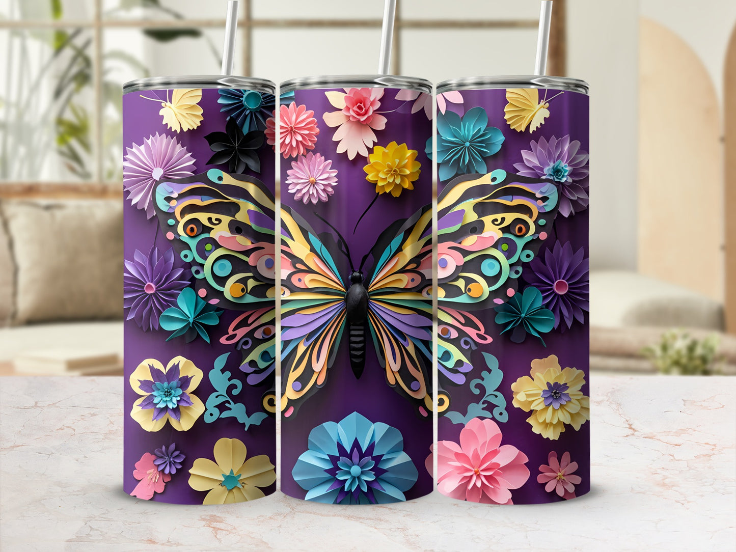 Three tumblers featuring a colorful layered butterfly and floral design on purple.