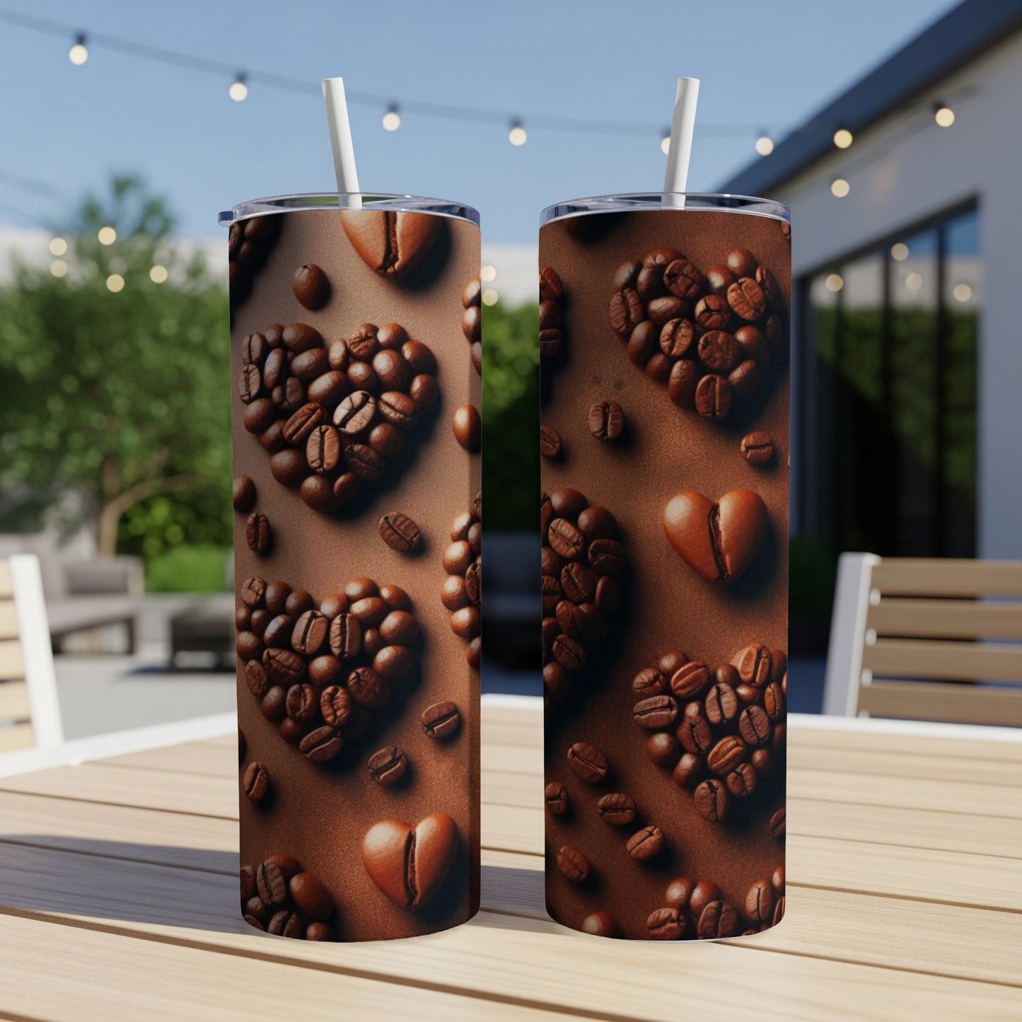 Two coffee tumblers with heart-shaped coffee bean designs.
