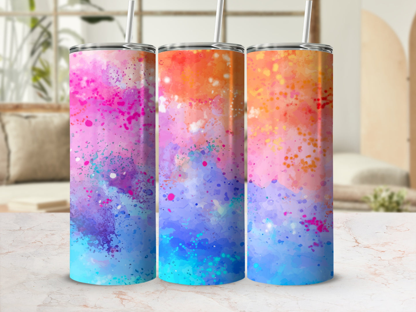 Three tumblers with vibrant watercolor splatter patterns in pink, orange, and blue.