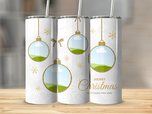 White tumblers with gold glitter Christmas ornaments and snowflakes.