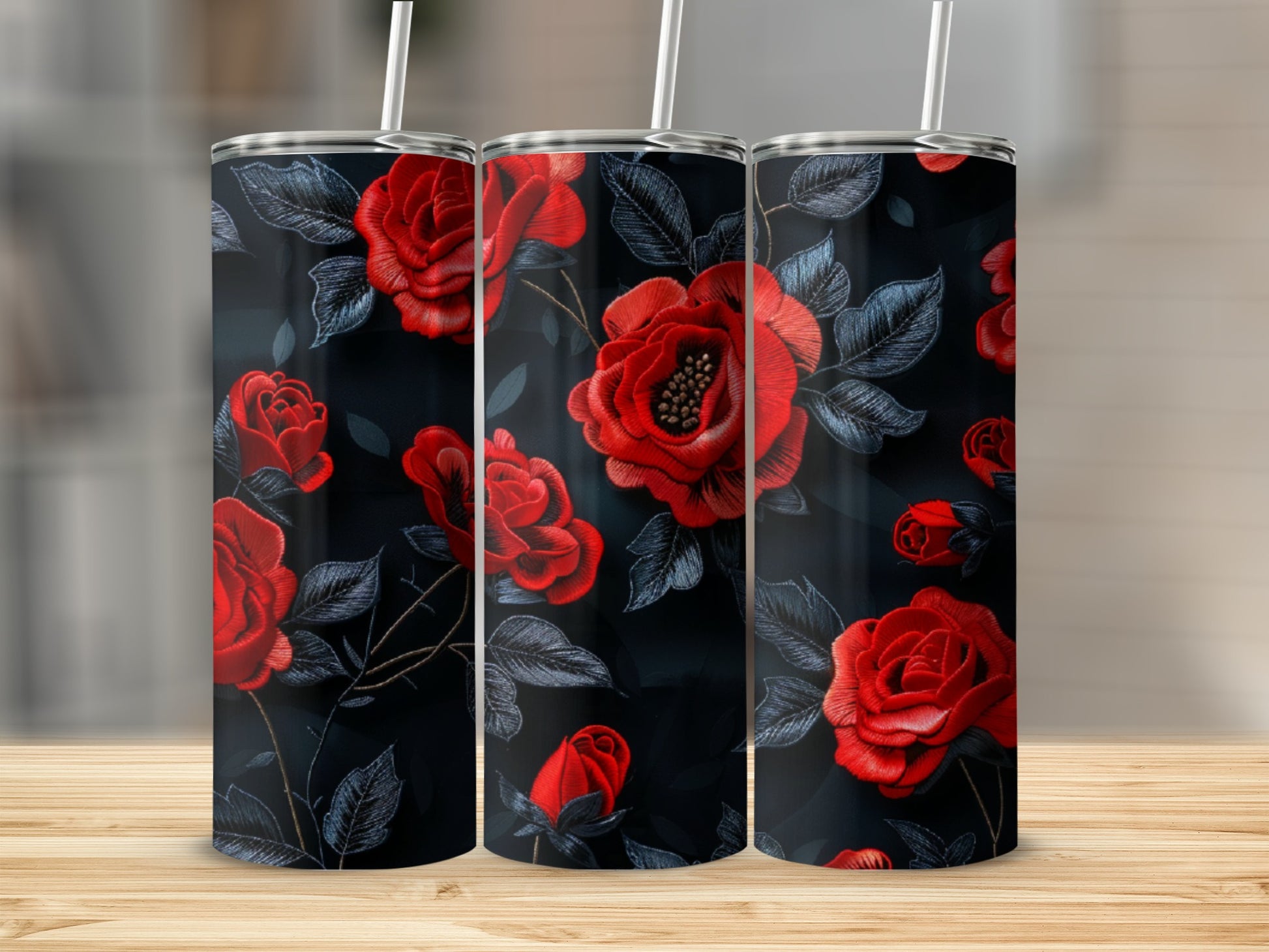 Three tumblers with a dark background and a red rose floral pattern.