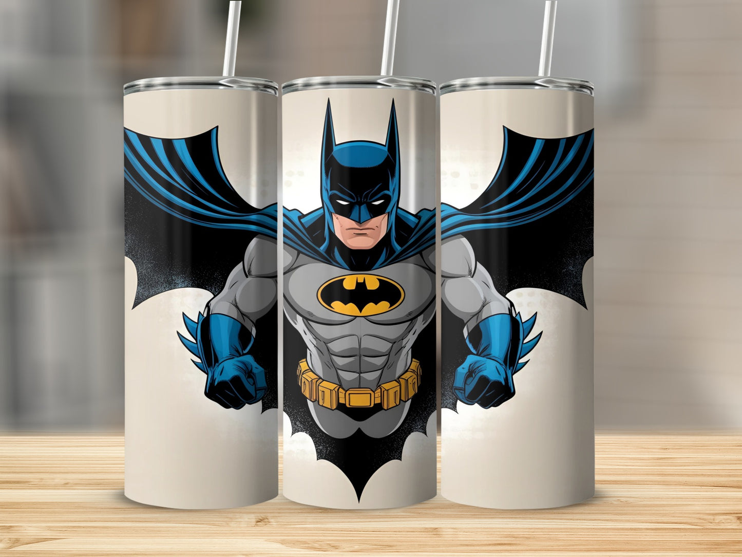 Batman in flight, cape extended, on a beige tumbler design.