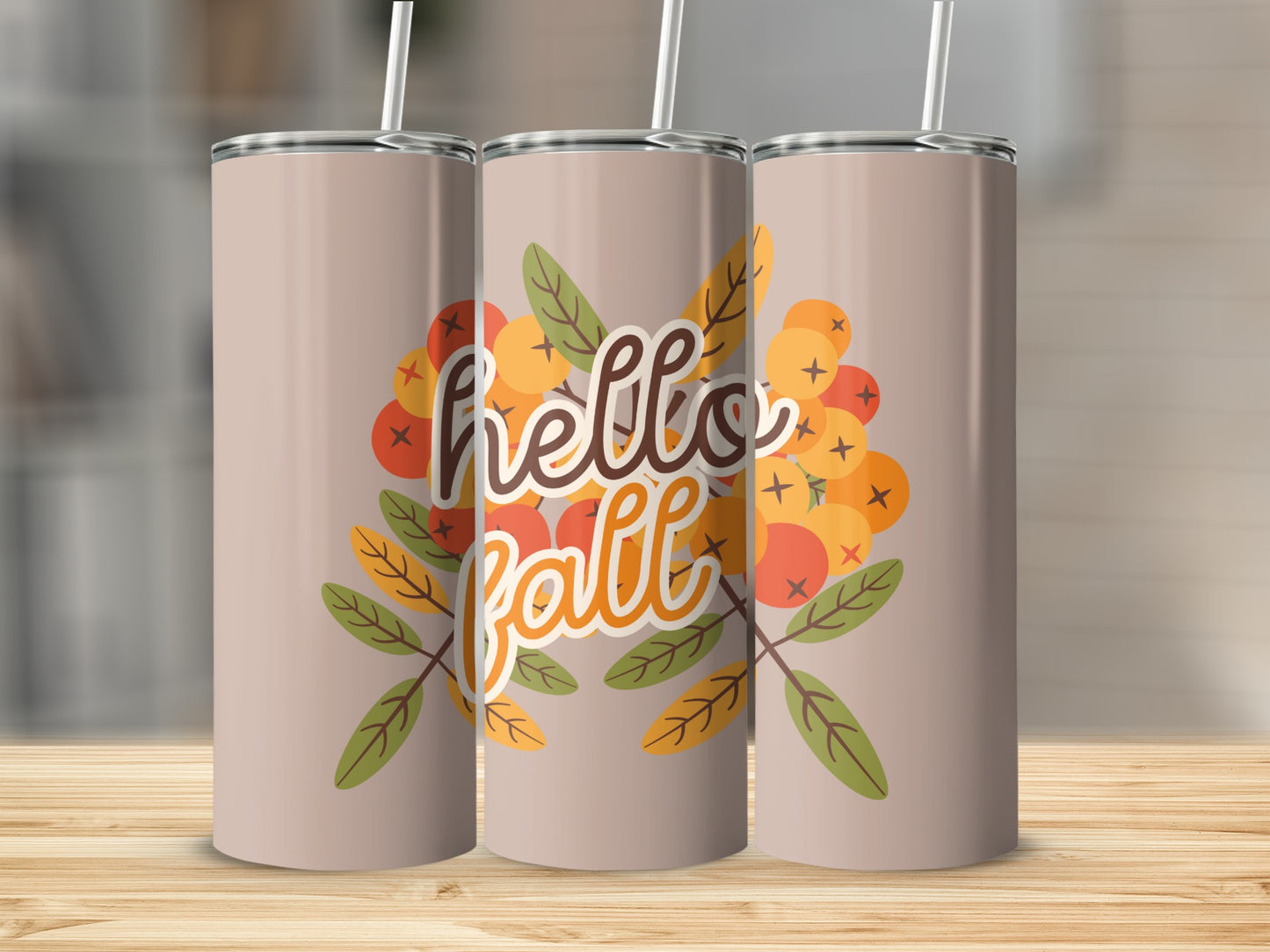 "Hello Fall" text on a tumbler with autumn berries and leaves.
