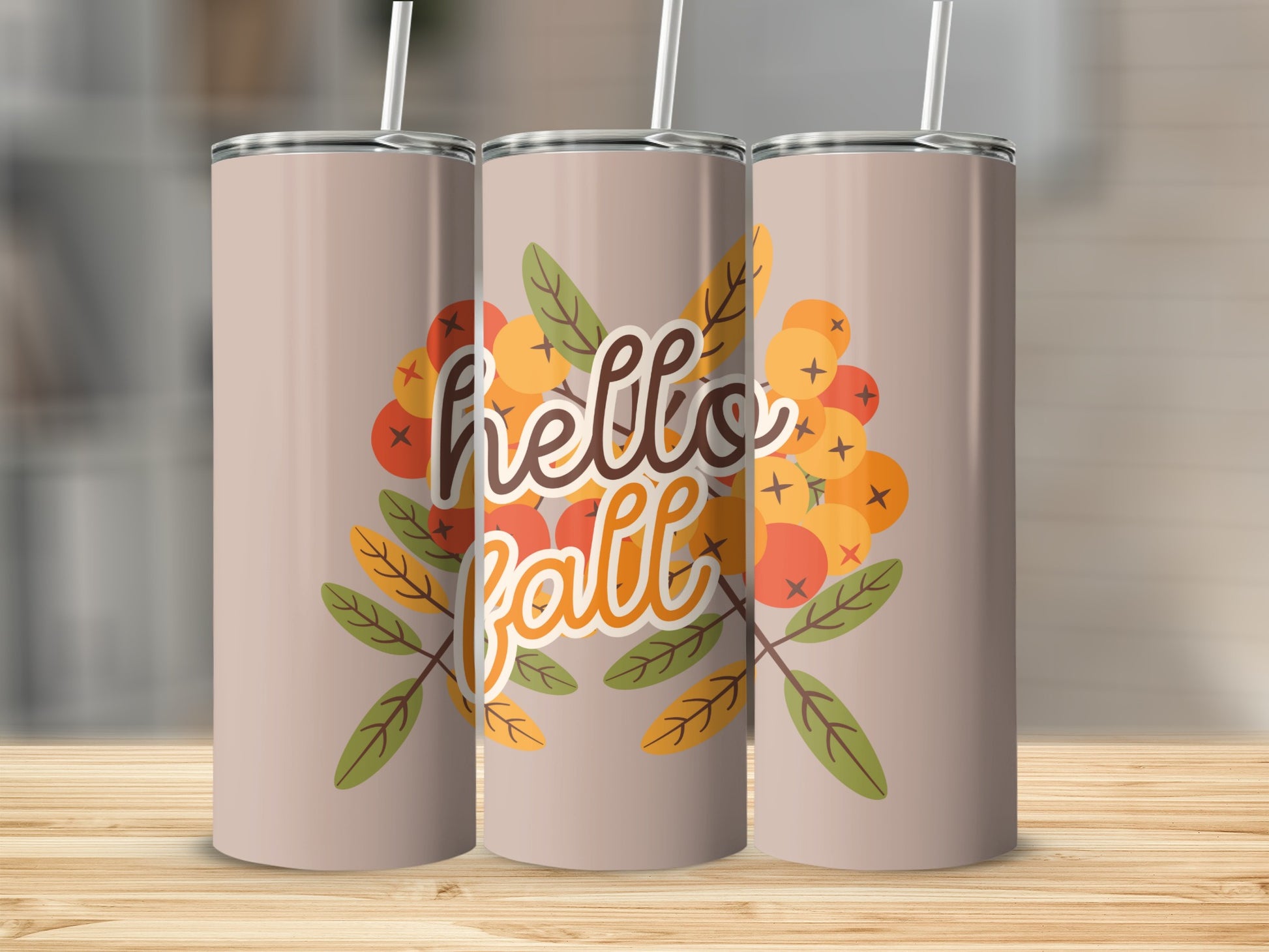 "Hello Fall" text on a tumbler with autumn berries and leaves.