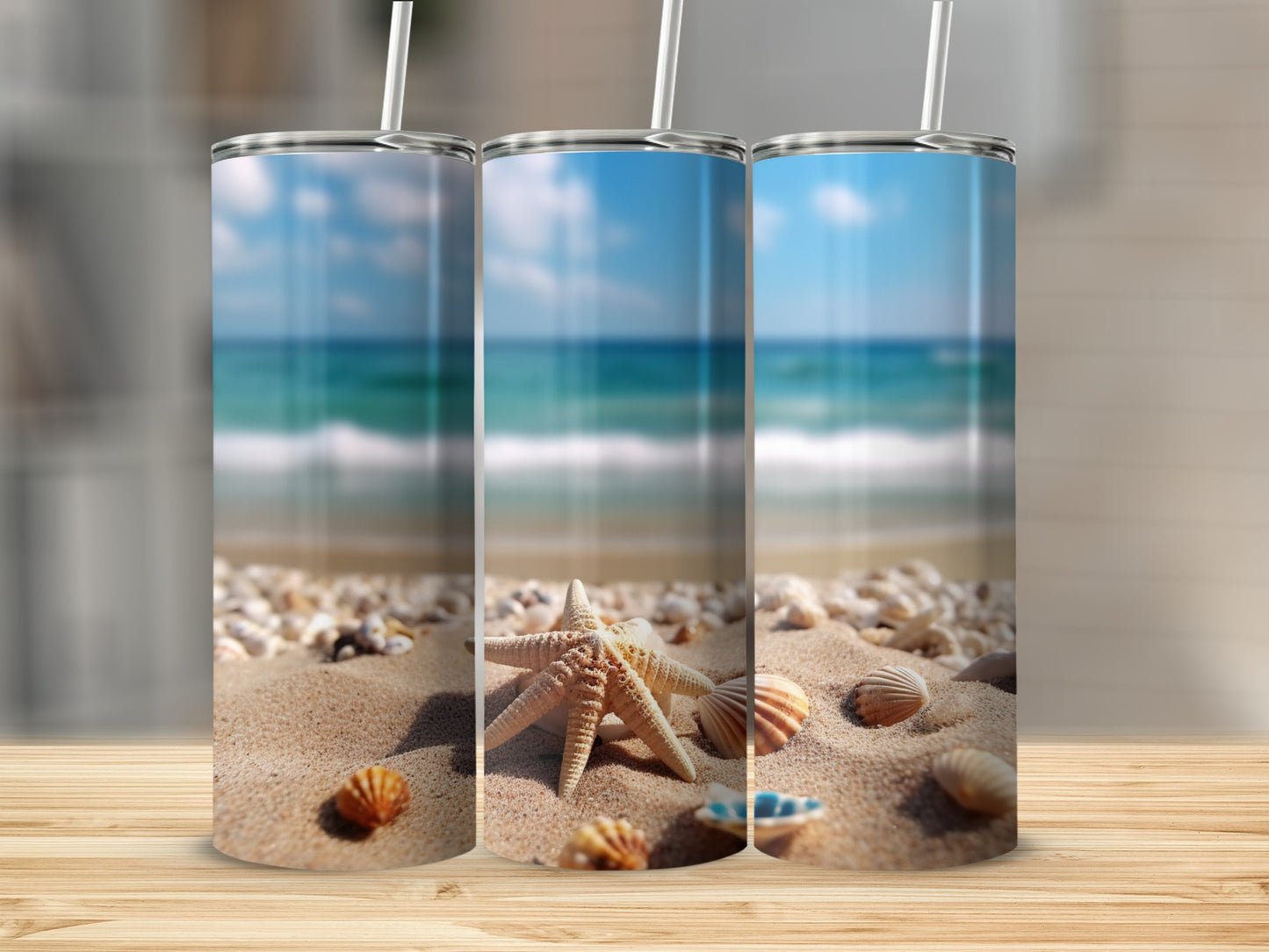 Three tumblers on a wooden surface with a beach scene background.