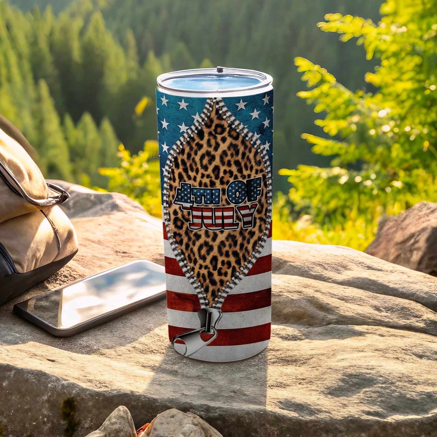 Tumbler with "4th of July" text and leopard print under a zipper.