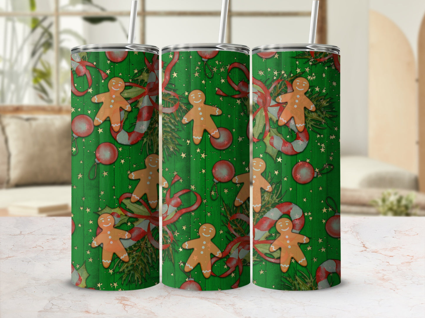 Three green tumblers with gingerbread men, candy canes, and ornaments pattern.