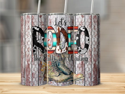 Tumbler with "RODEO" and "The Bulls Are Waiting" text, featuring boots.