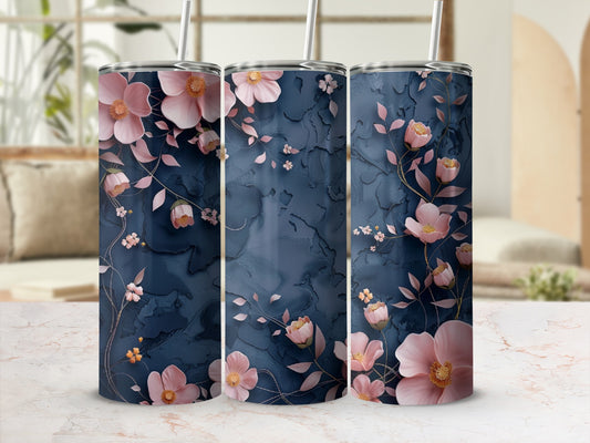 Three tumblers with pink floral and leaf patterns on a dark blue background.