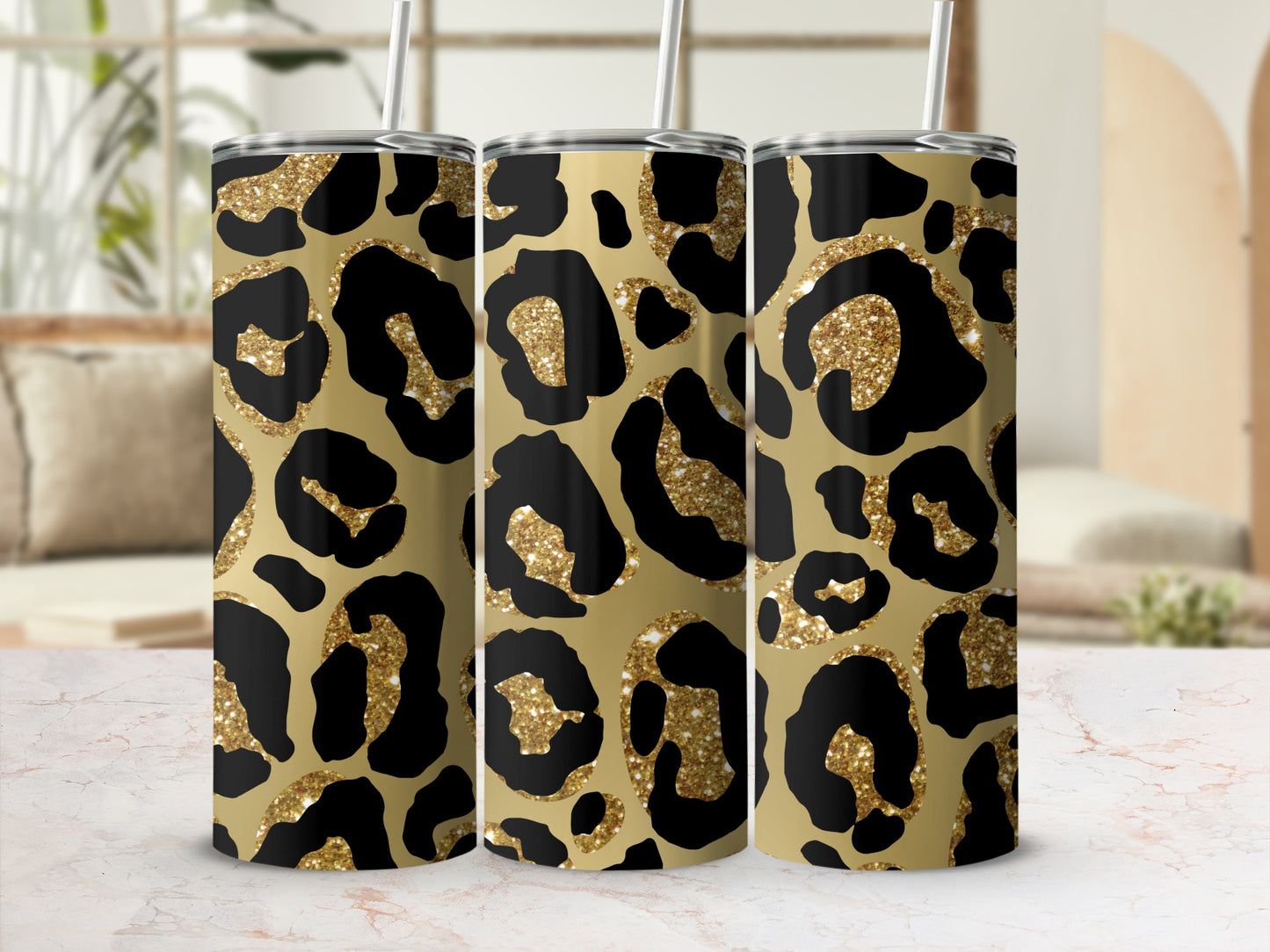 Three tumblers with a gold leopard print and glitter accents.