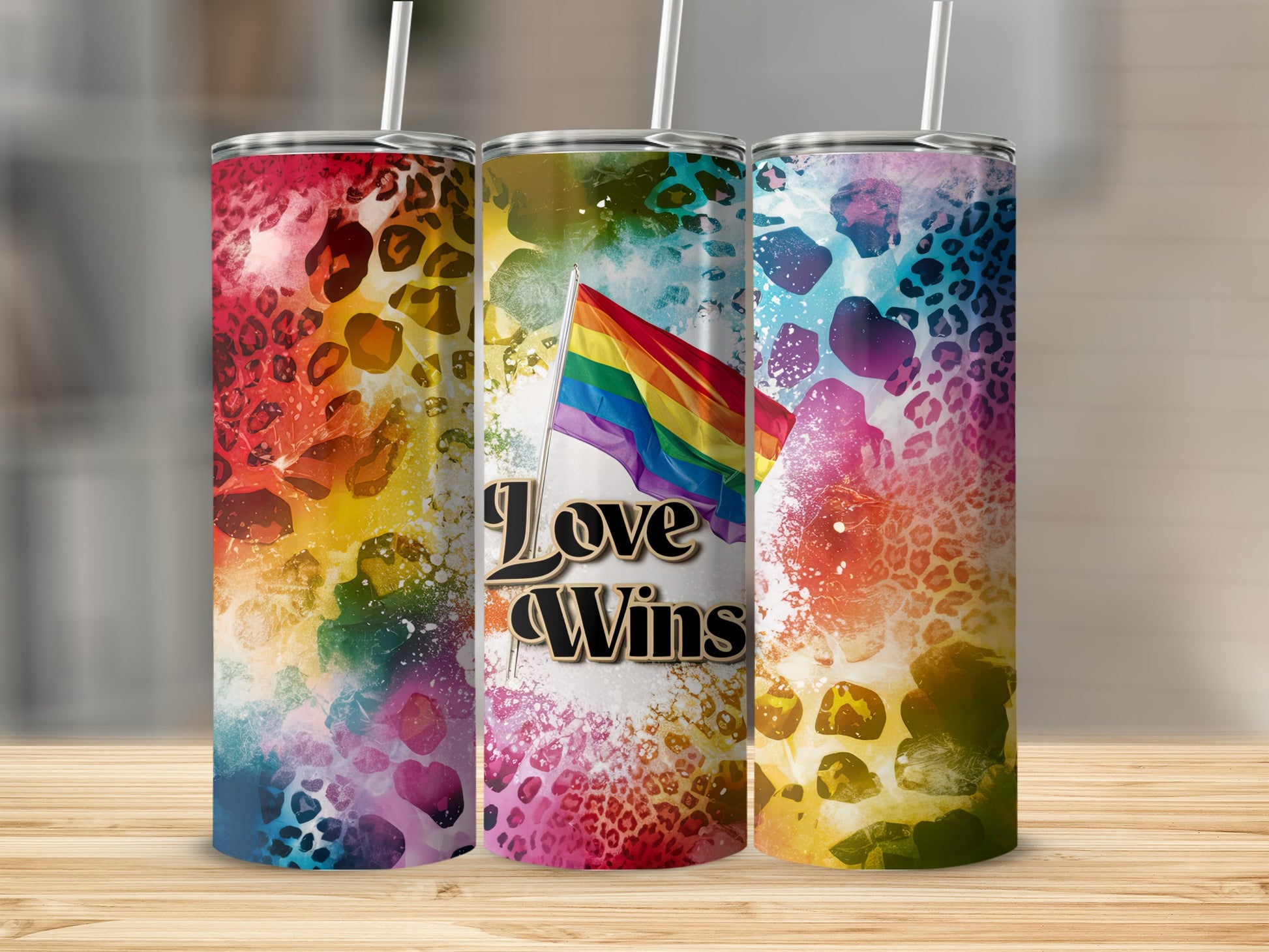 Three tumblers with rainbow flag and "Love Wins" text.